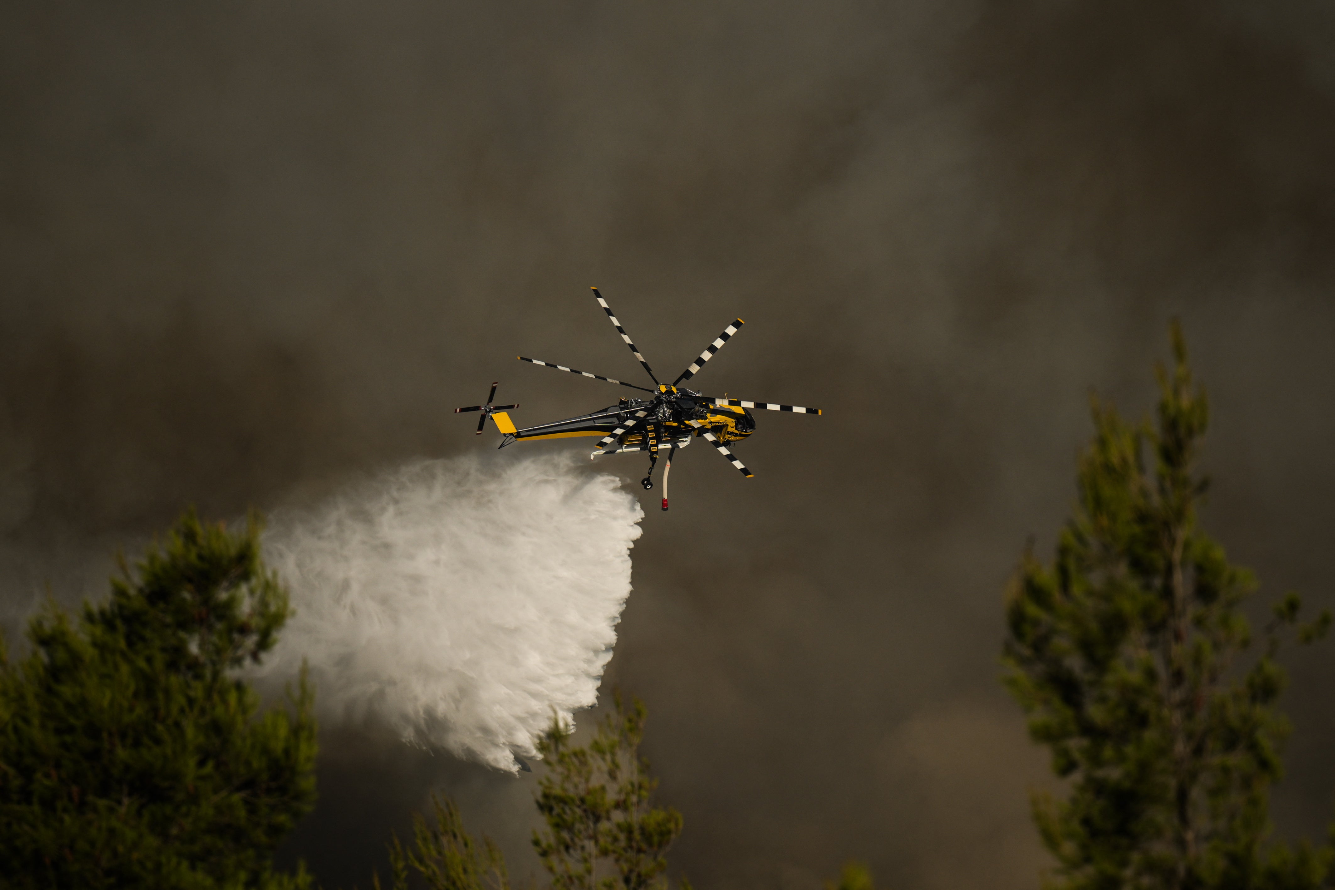 Two helicopters collide while fighting wildfires in Greece