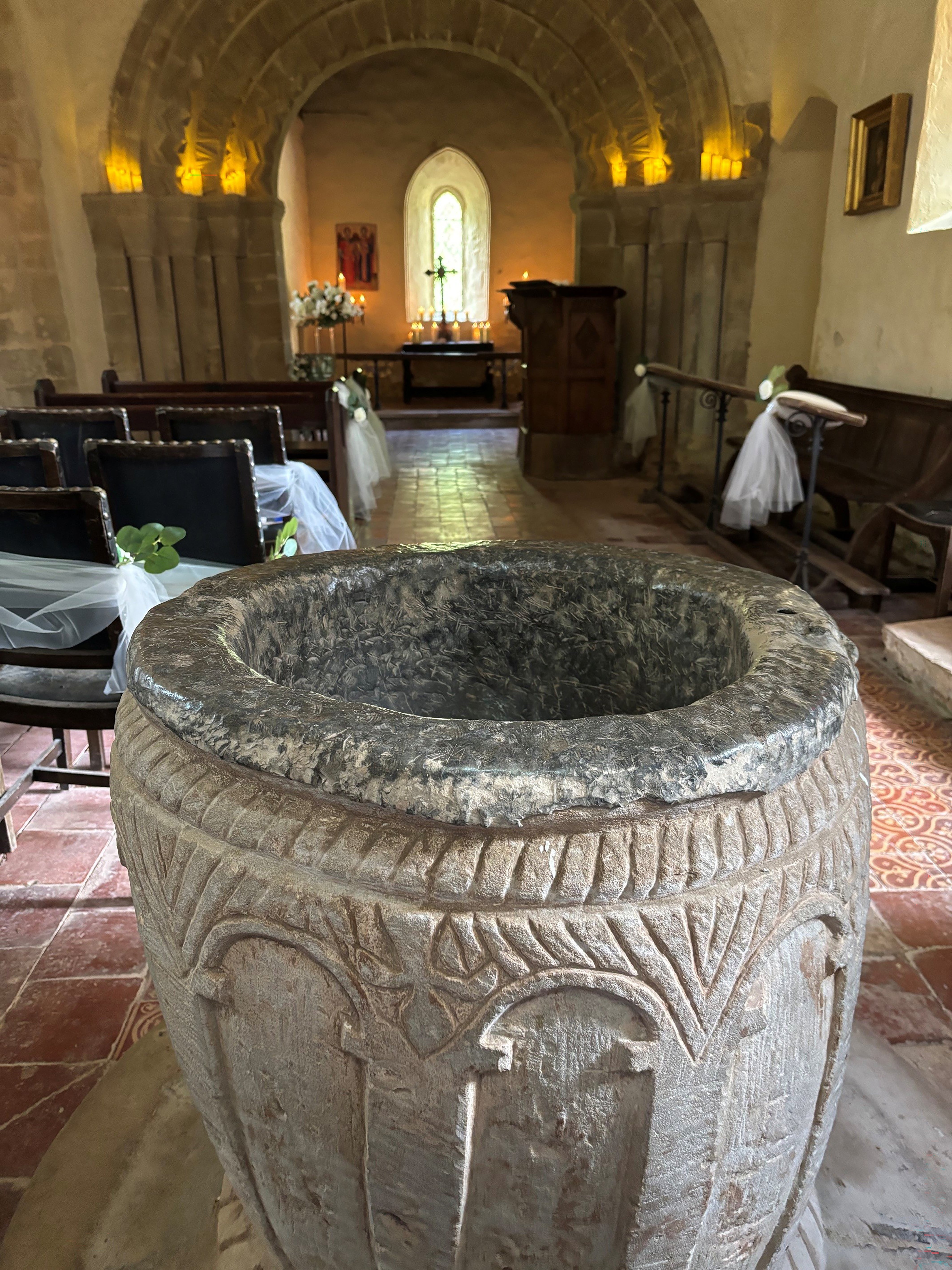 The Norman font at St Michael's Church in Upton Cressett, Shropshire