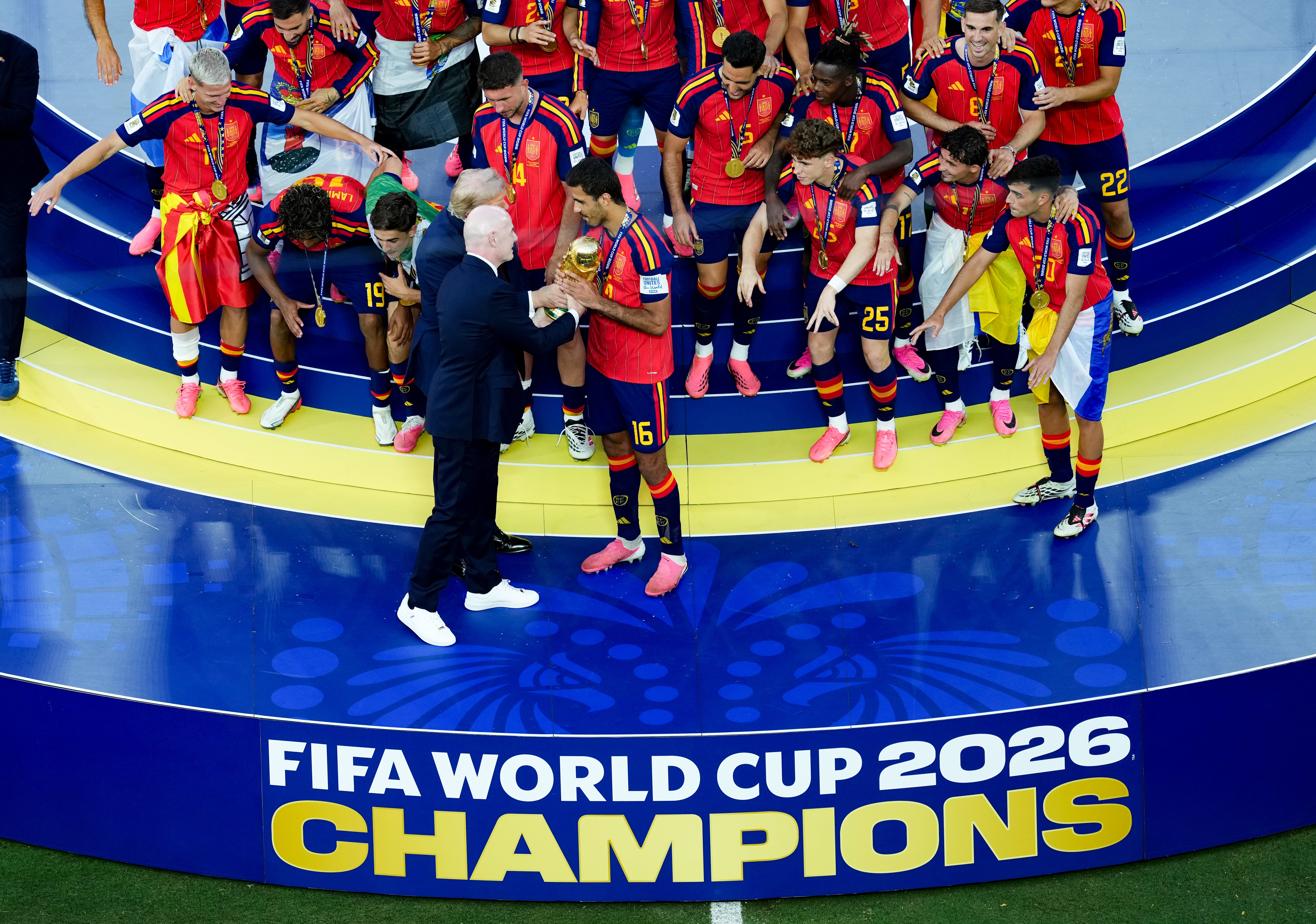 FIFA president Gianni Infantino presents the World Cup trophy to Spain (Martin Rickett/PA)