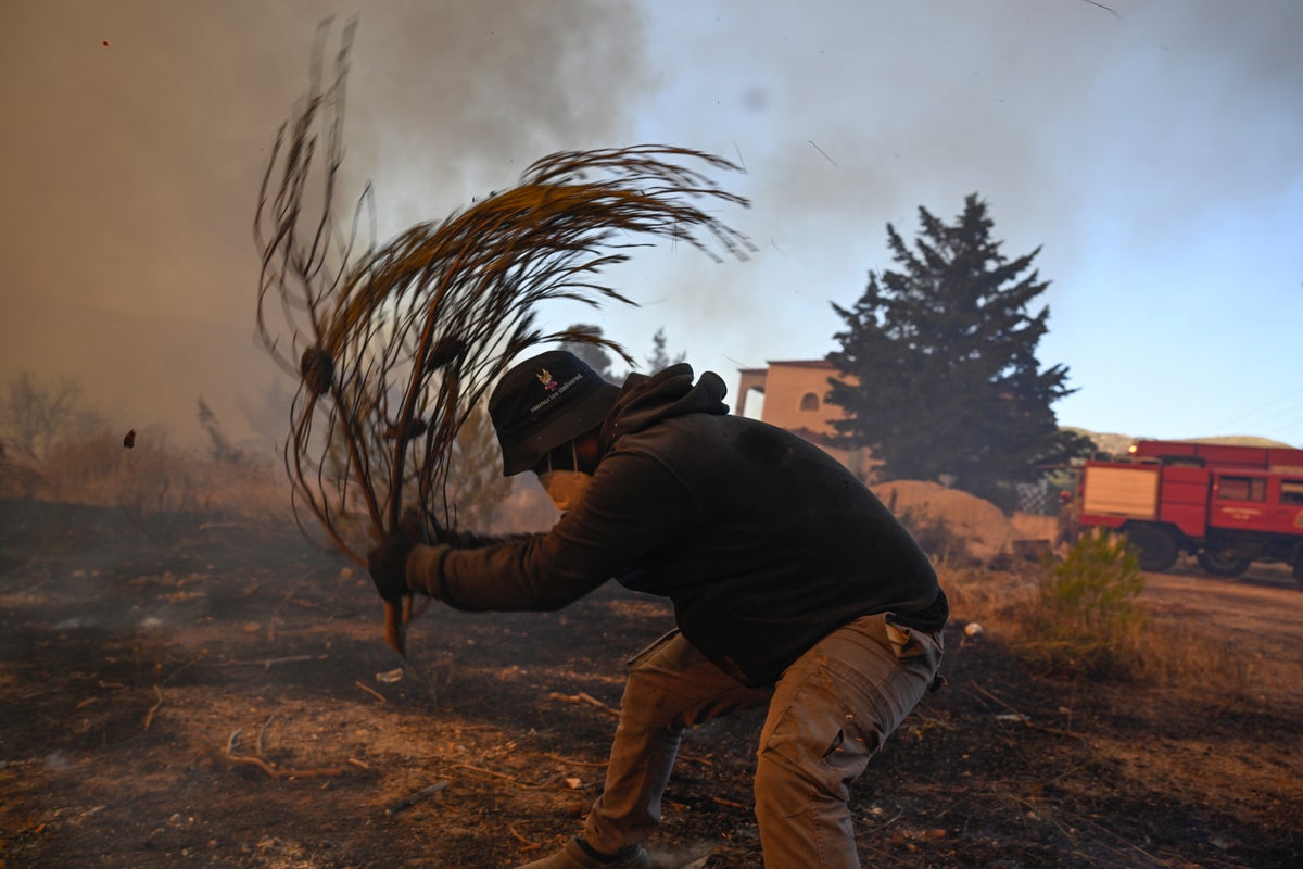 Water-dropping aircraft take off to tackle major Greek wildfire, after 2 killed in crash