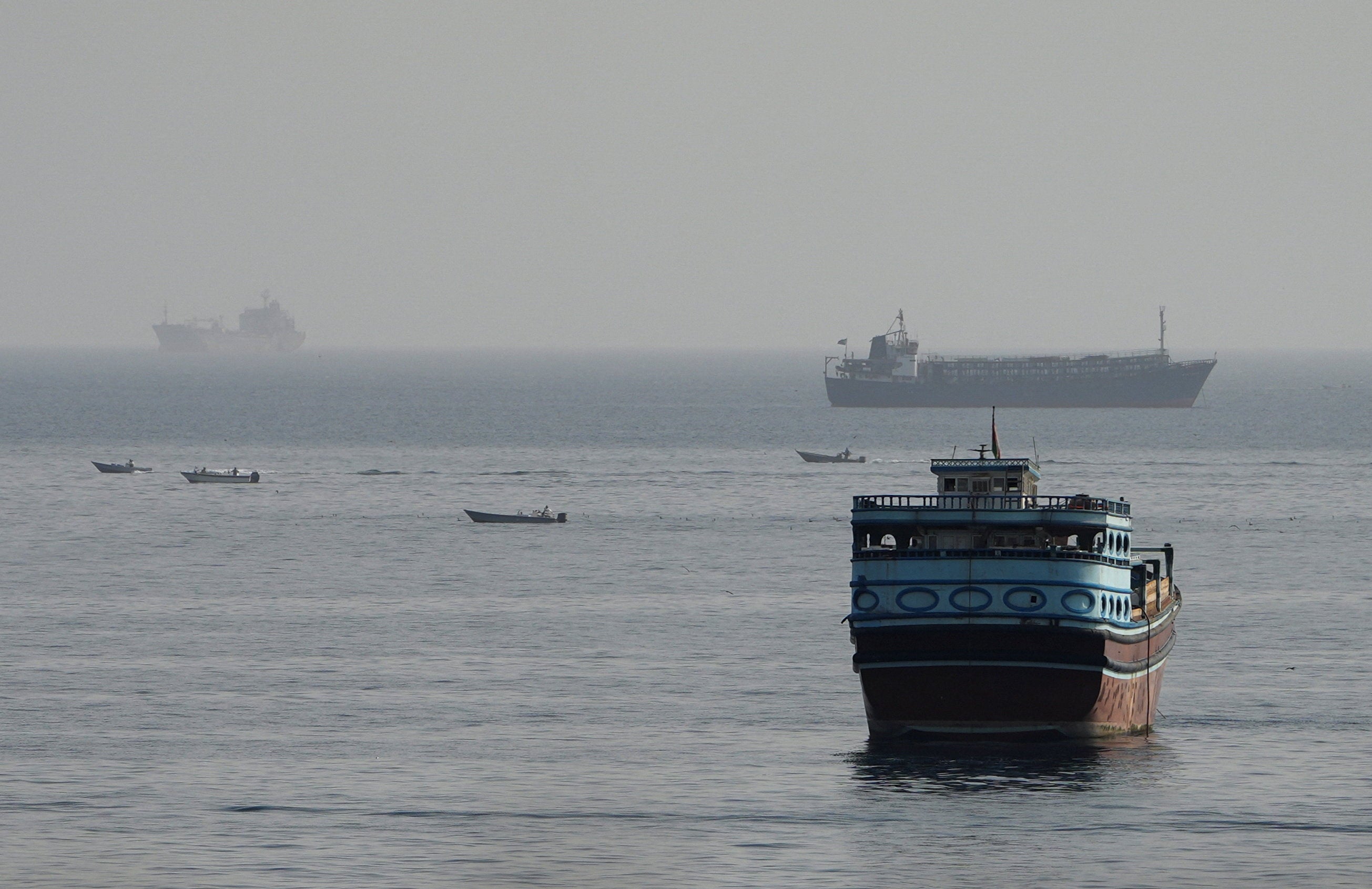 Vessels in the Strait of Hormuz, as seen from Musandam, Oman, on 3 August (Reuters)