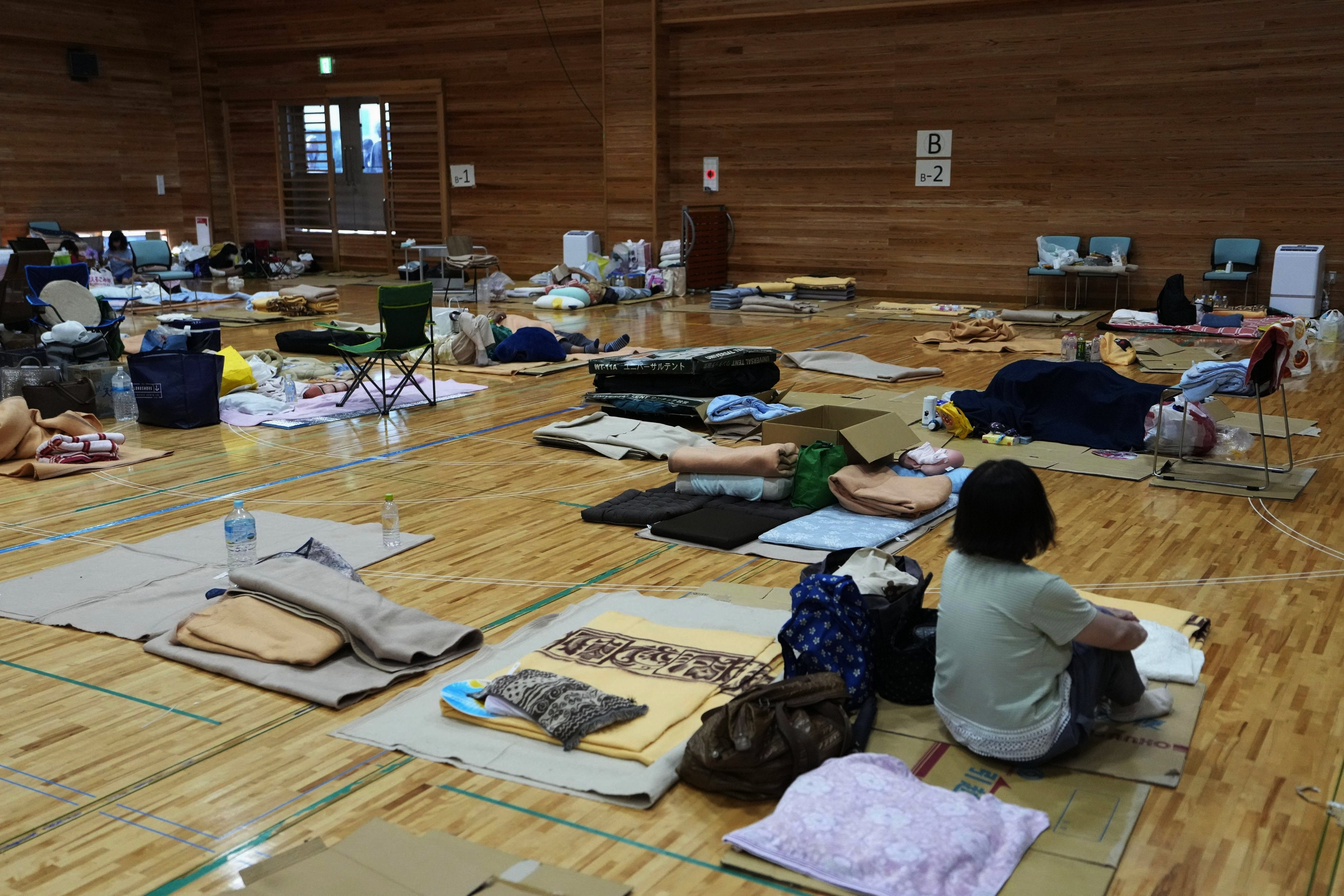 Japan earthquake claims 38th victim as woman found dead in car