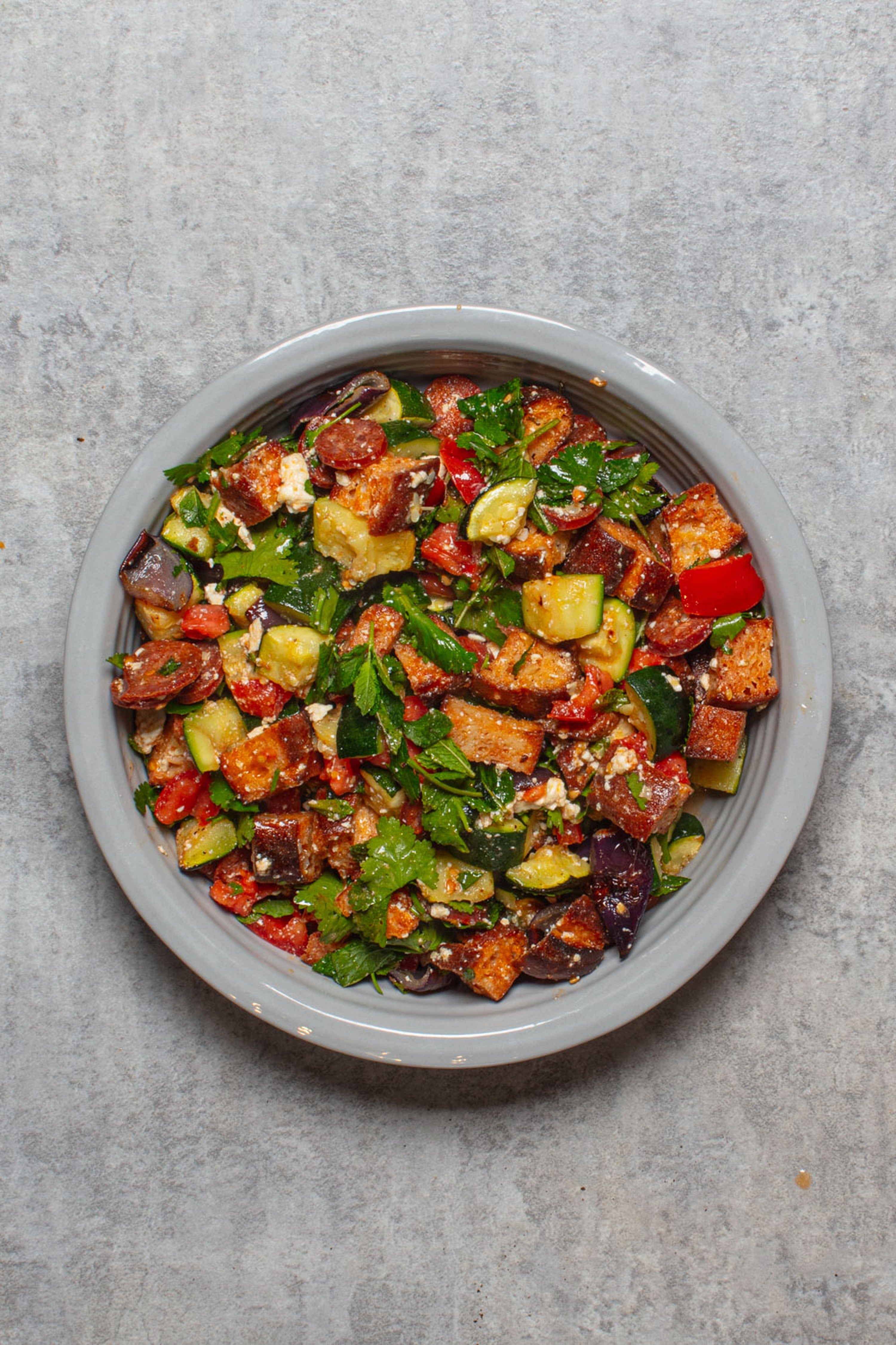 Charred courgettes, crisp croutons and feta turn a summer salad into dinner