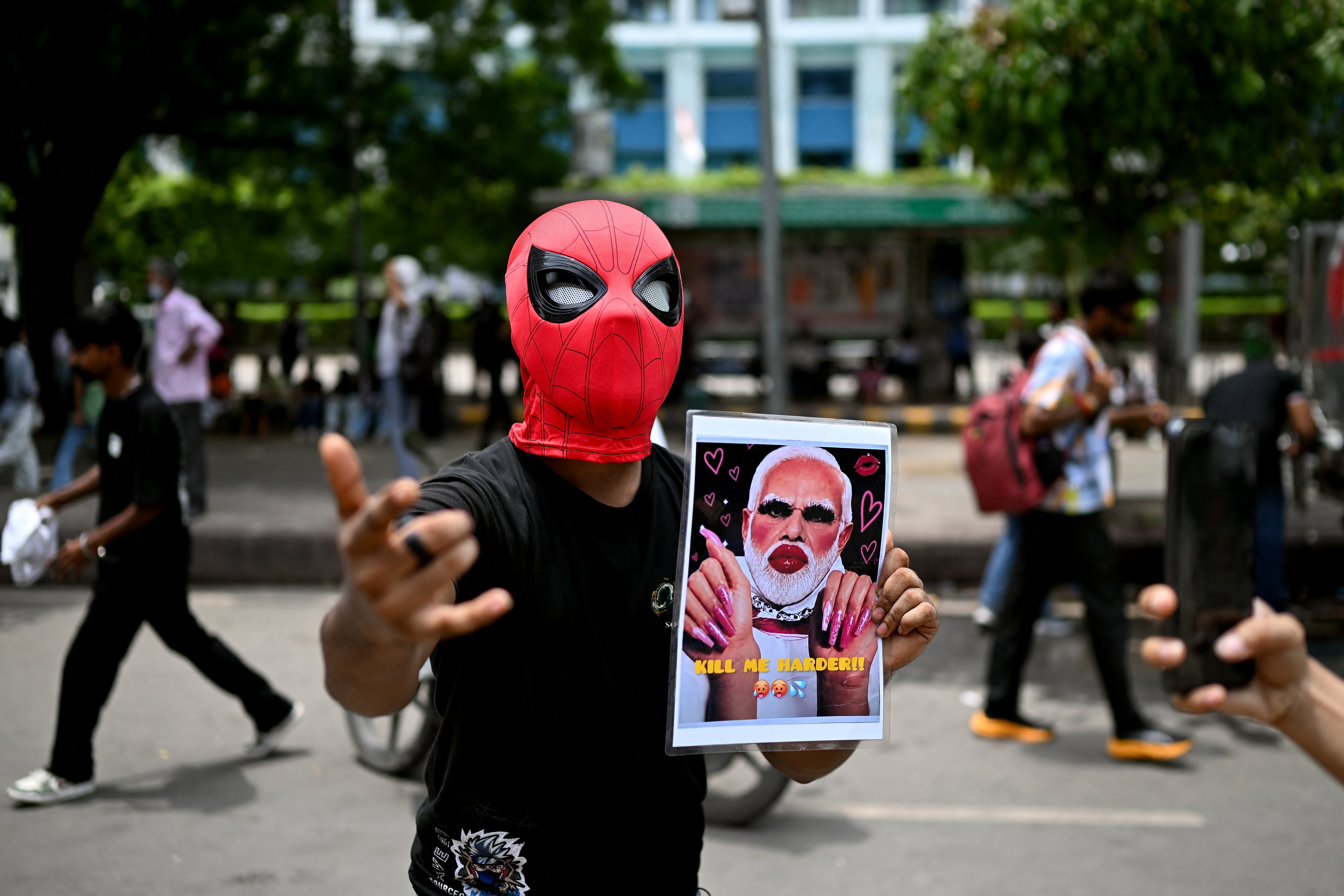 A protester holds a placard of India's prime minister Narendra Modi in Delhi