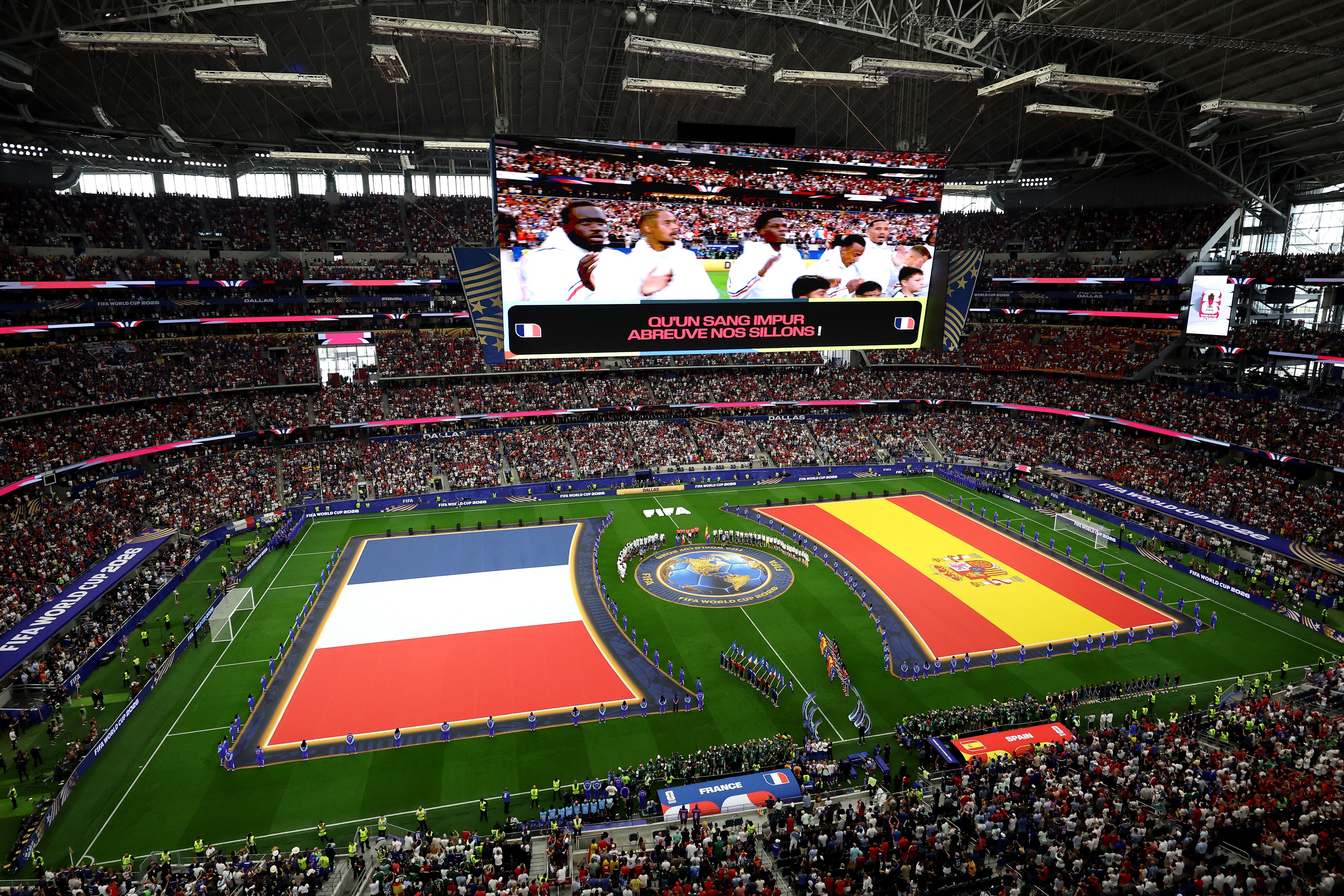 Players and match officials line up before the FIFA World Cup 2026 Semi Final match between France and Spain at Dallas Stadium on July 14, 2026 in Arlington, Texas