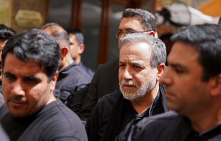 Iranian Foreign Minister Abbas Araqchi walks during a visit to the holy city of Najaf ahead of Arbaeen, one of the largest annual Shi'ite religious gatherings, on 3 August