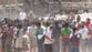 Migrants fight over aid on Ceuta beach as hundreds set up camp