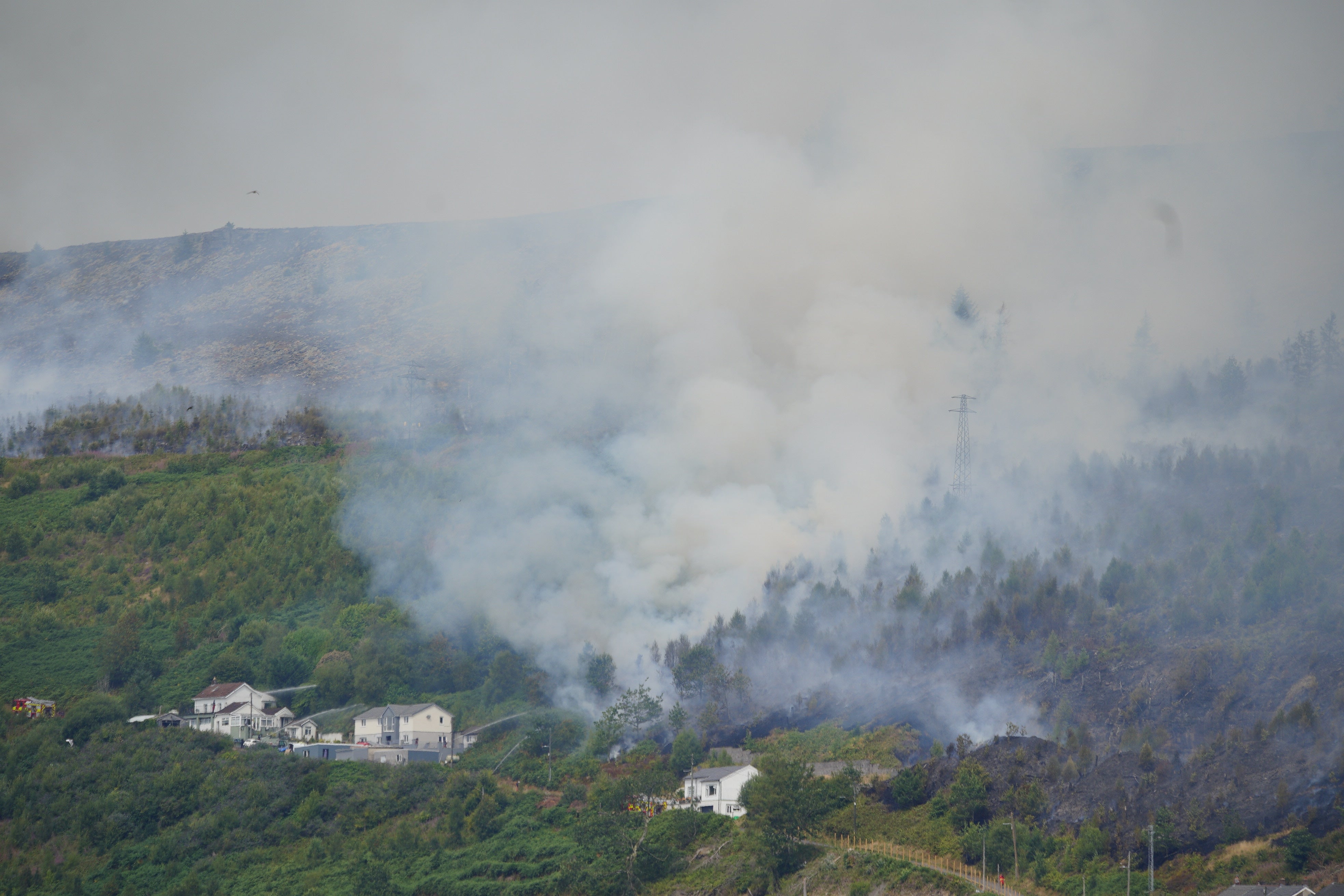 The hot dry conditions have provoked wildfires (Ben Birchall/PA)