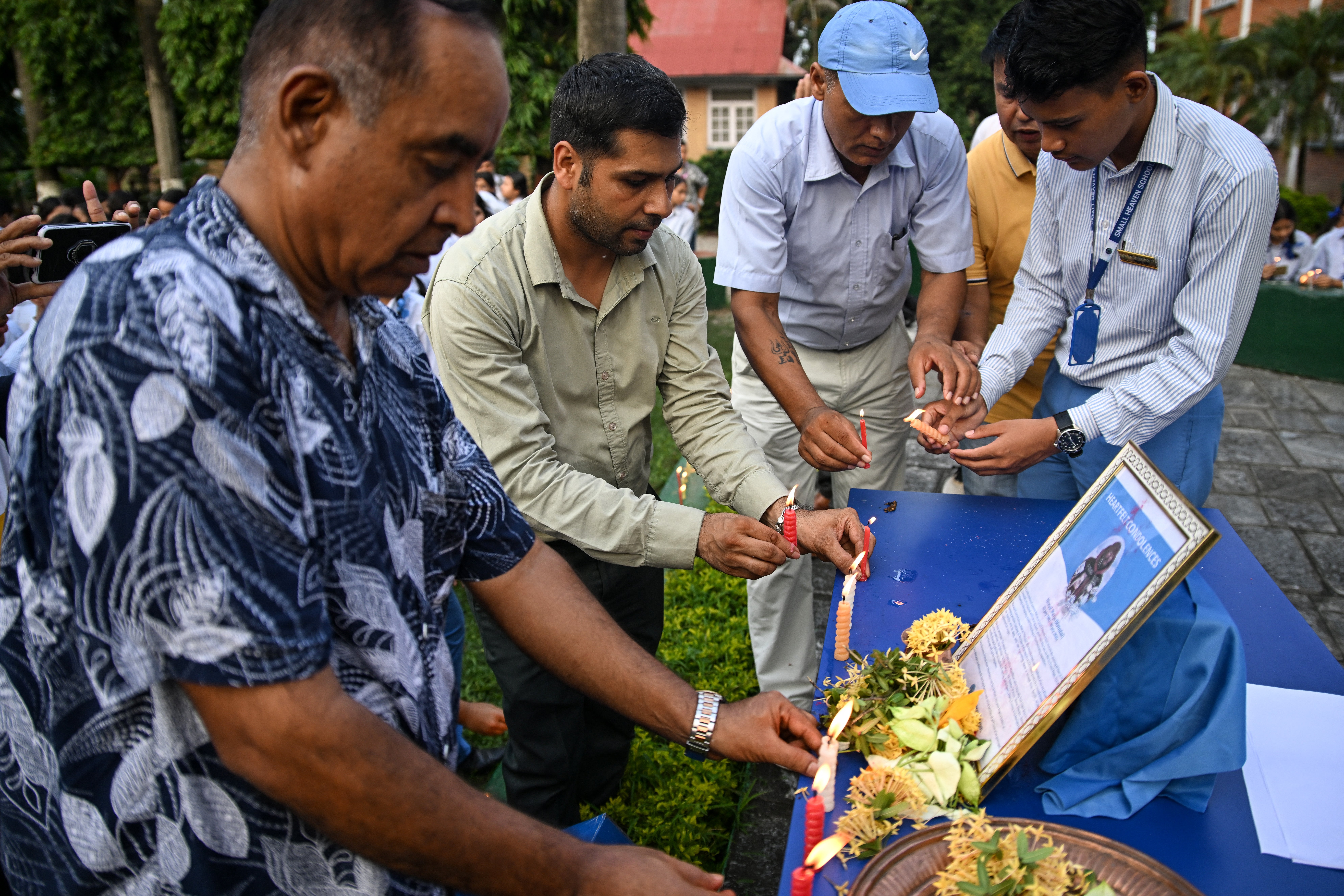 Mourners light candles for Nirmal Purja and his fellow climbers at Small Heaven School in Chitwan on 2 August 2026 (AFP/Getty)