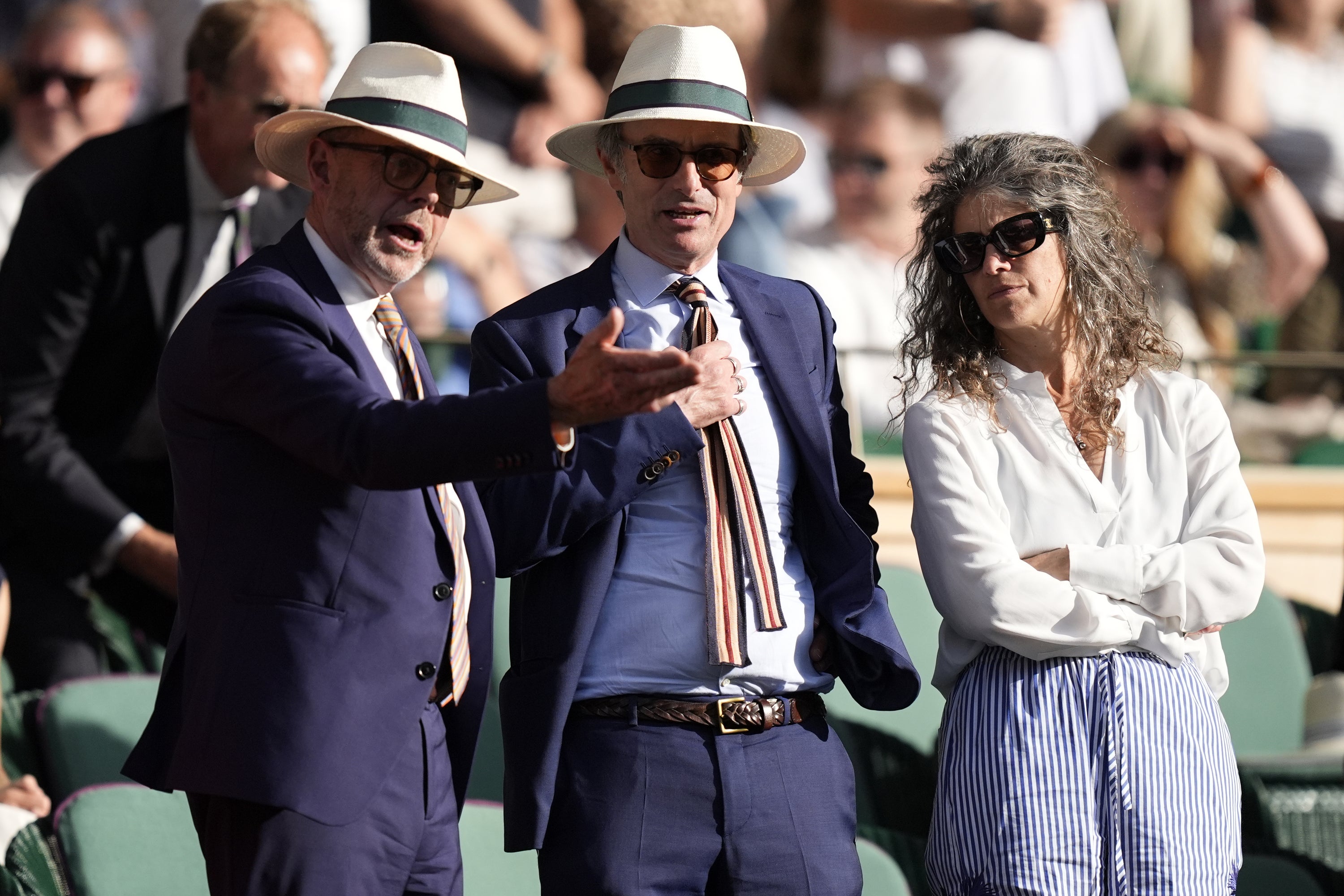 From left: Nick Robinson, Robert Peston and his new partner Nell Breyer at Wimbledon this year (PA)