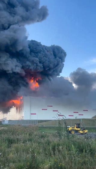Smoke rises after a Ukrainian drone attack on a Wildberries warehouse, in Krasny Bor, Leningrad Region