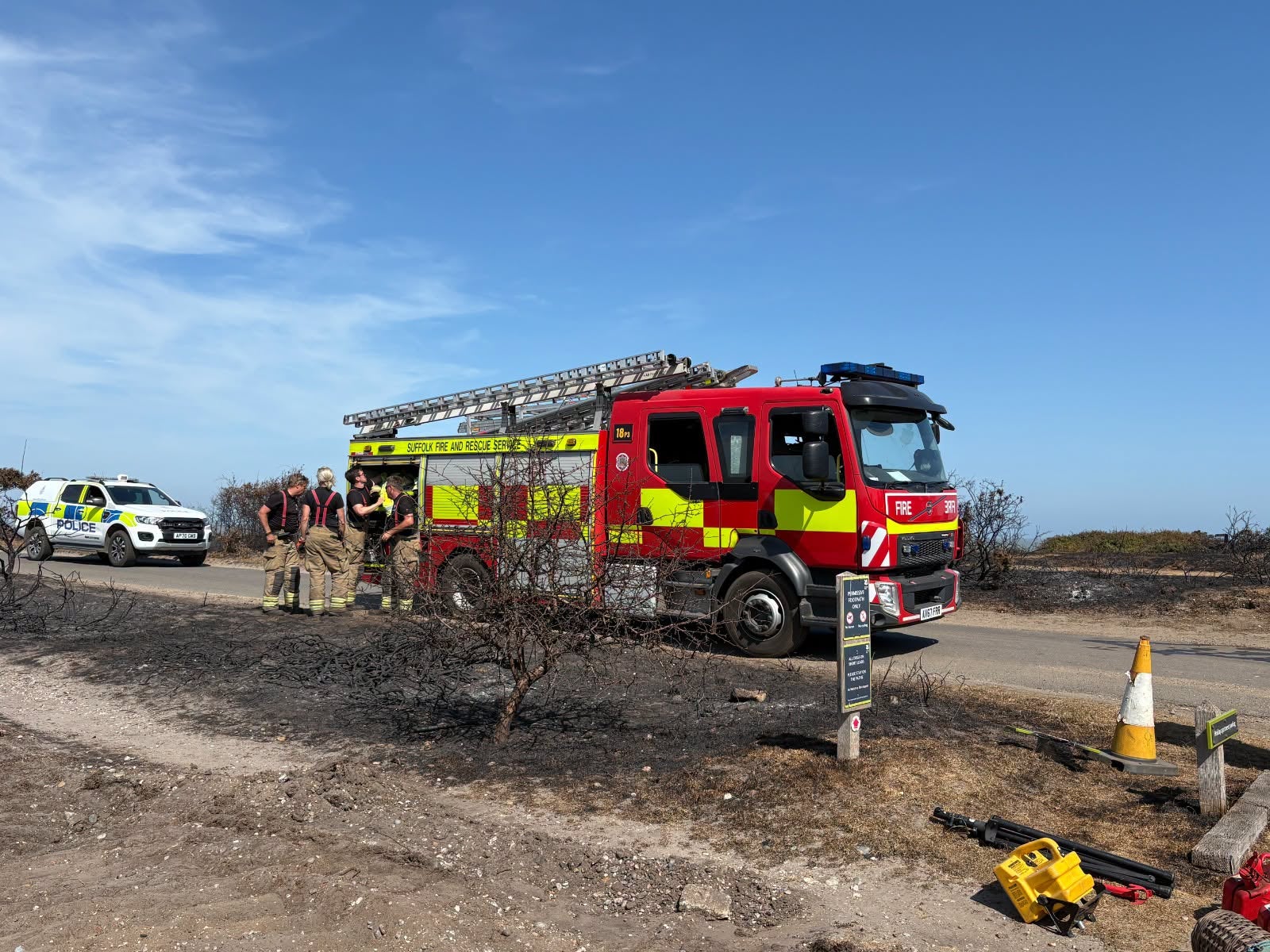 Firefighters forced to escort dog walkers away from wildfire scorched Dunwich Heath