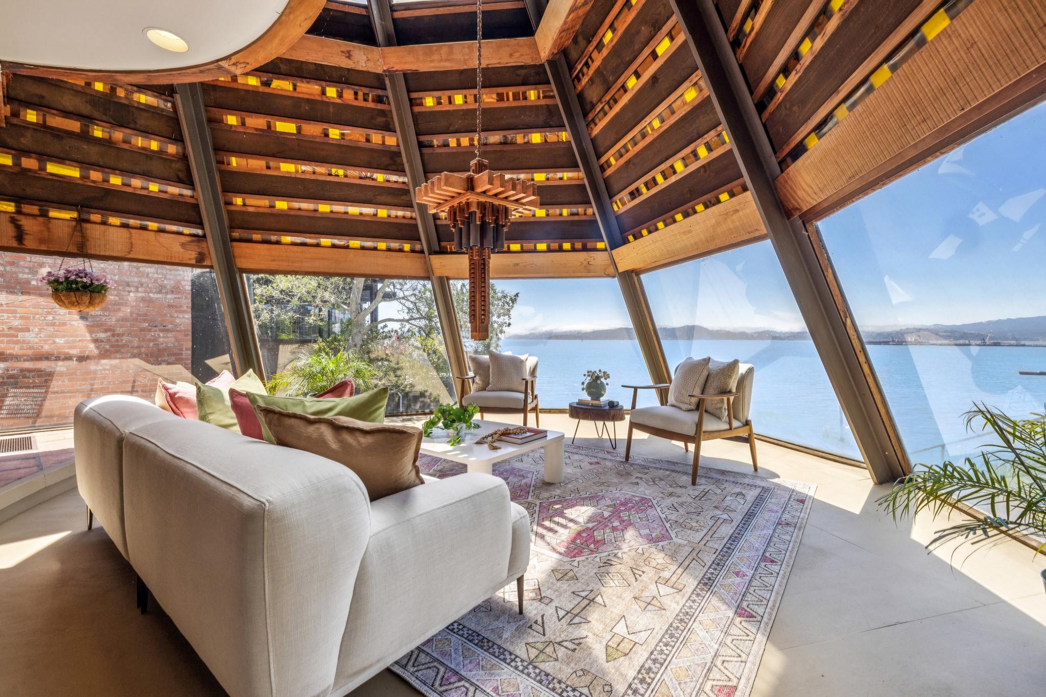 The house’s major selling point is the massive windows that wrap around it and open up the space with stunning views of the famed Golden Gate Bridge (Open Homes Photography)