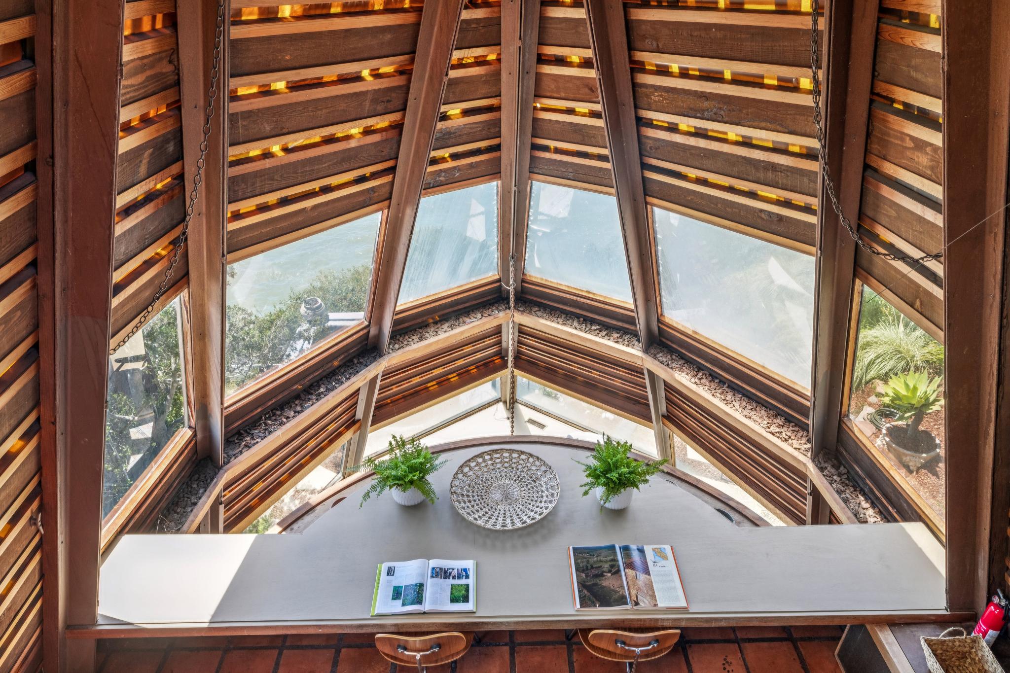 The first mezzanine level includes a long, built-in desk and chairs, perfect for either eating a meal or working from home (Open Homes Photography)