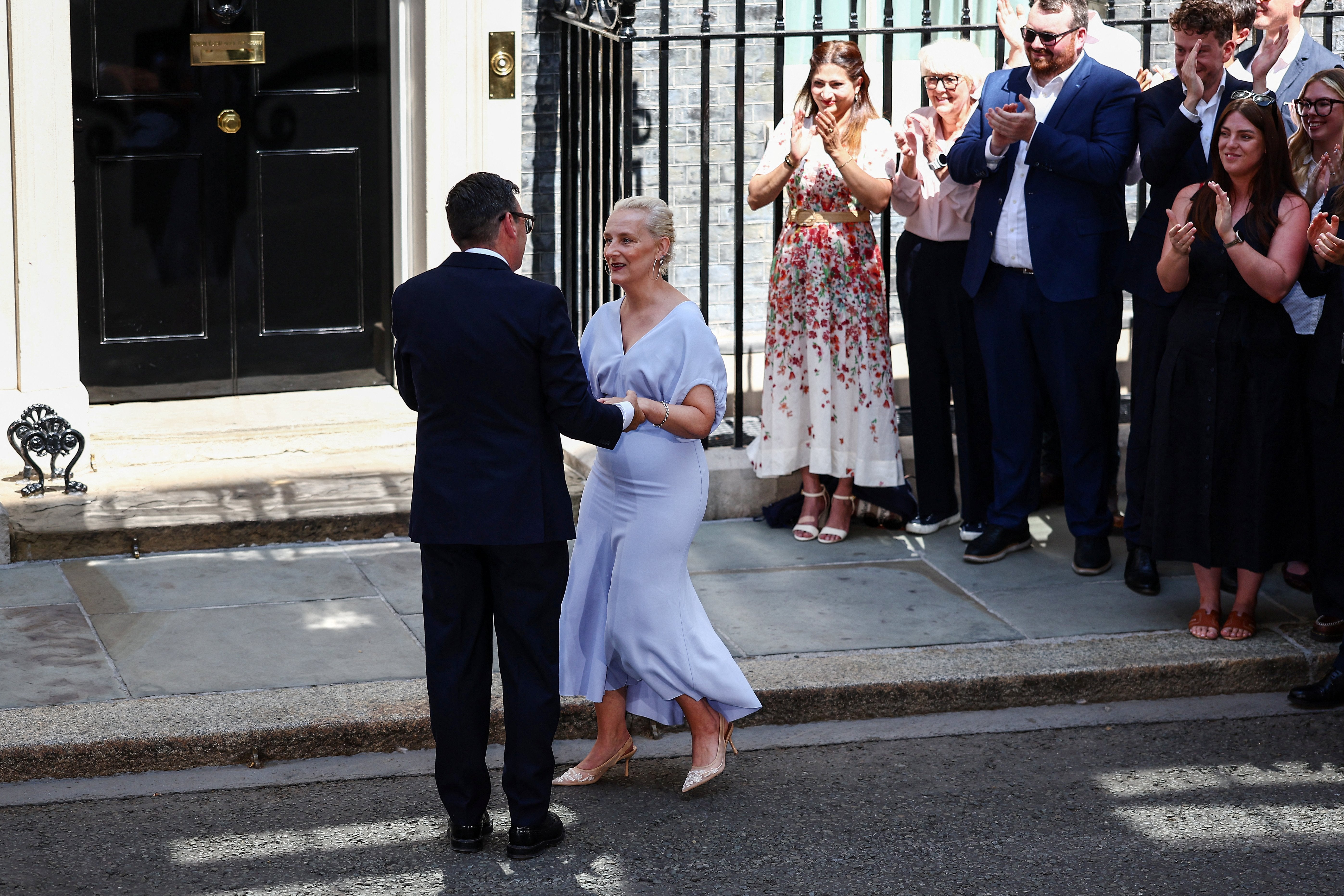 Andy Burnham kisses his wife Marie-France van Heel in front of 10 Downing Street