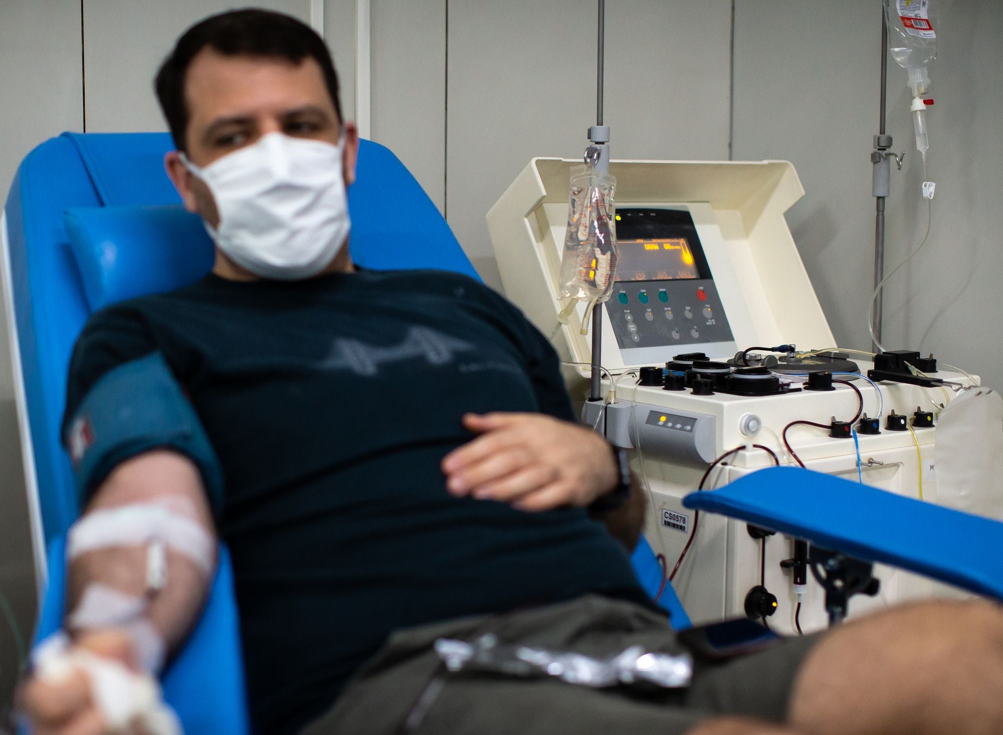 Man donates plasma through a process called plasmapheresis
