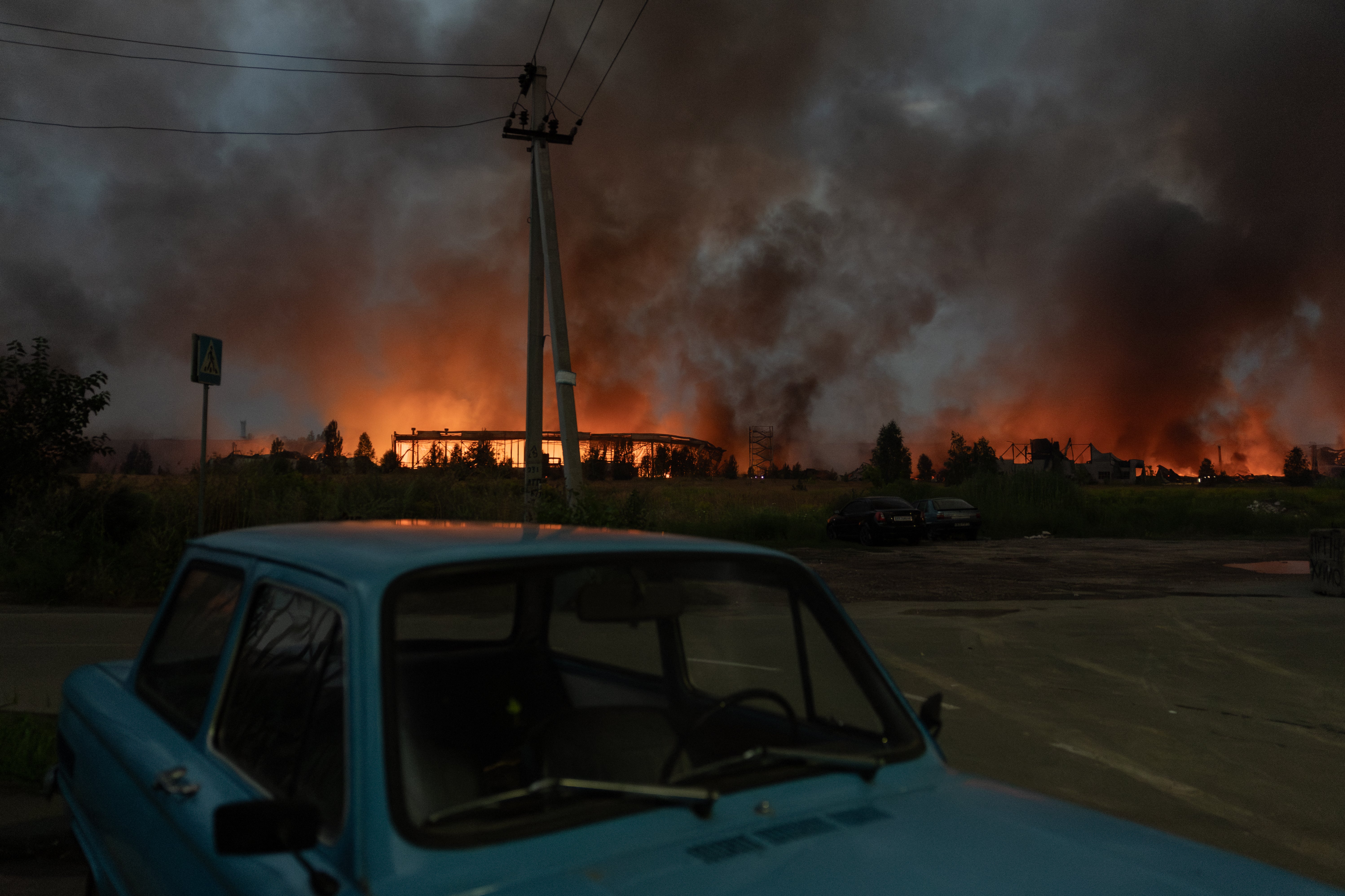 Fire and smoke rises from a warehouse destroyed during massive Russian ballistic missile and drone strikes on the outskirts of Kyiv (AFP/Getty)