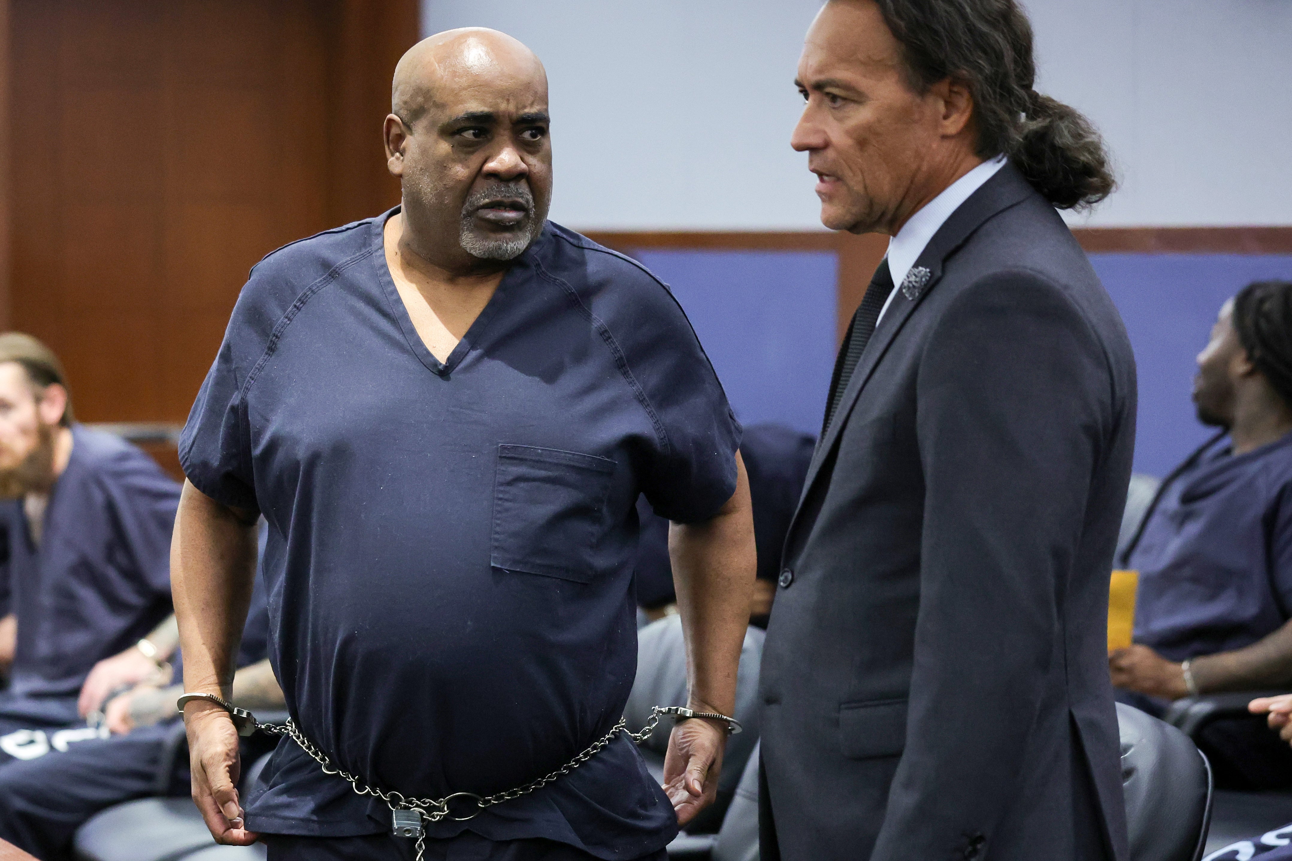 Duane Davis, left, talks with his attorney Michael Sanft in Clark County District Court during a calendar call and motion hearing for Davis' upcoming trial
