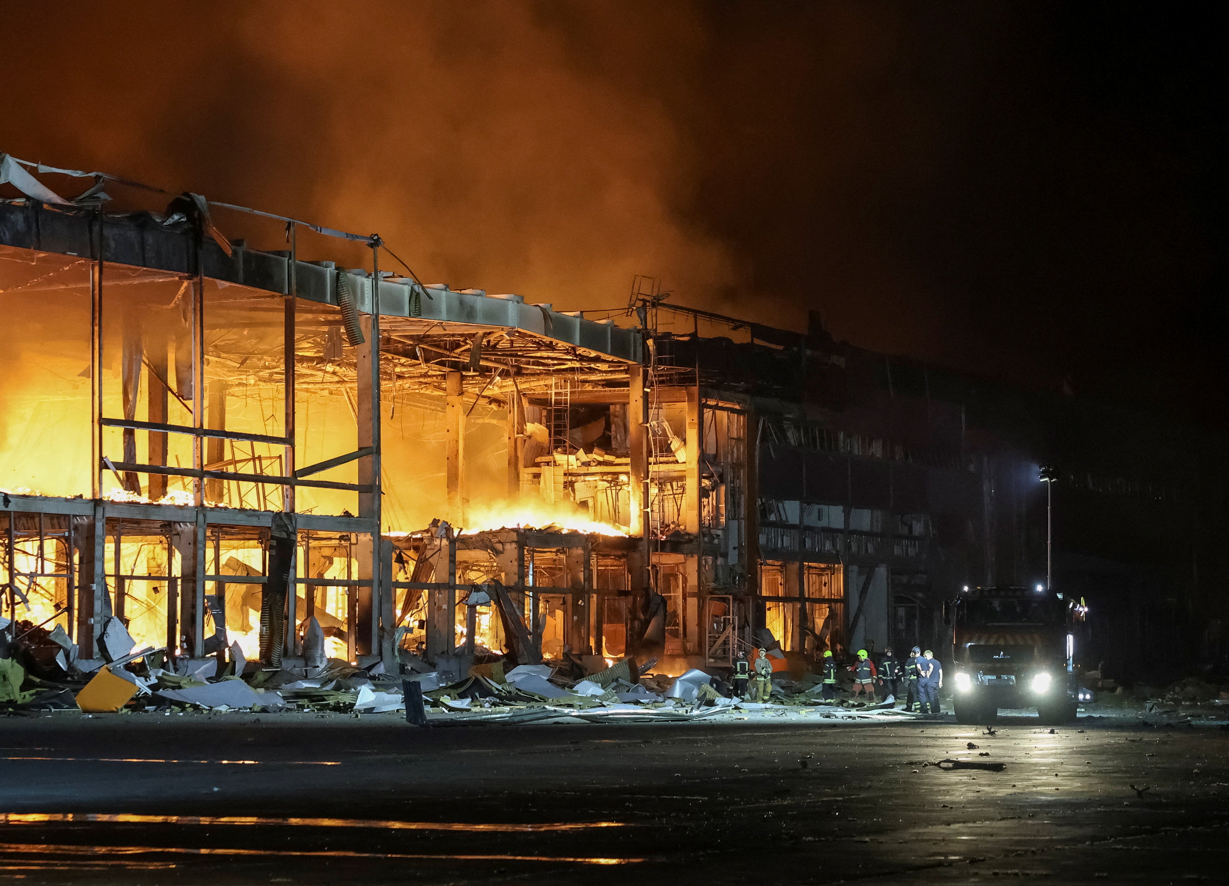 Firefighters work at a site of a Russian missile strike in Kyiv region (Reuters)