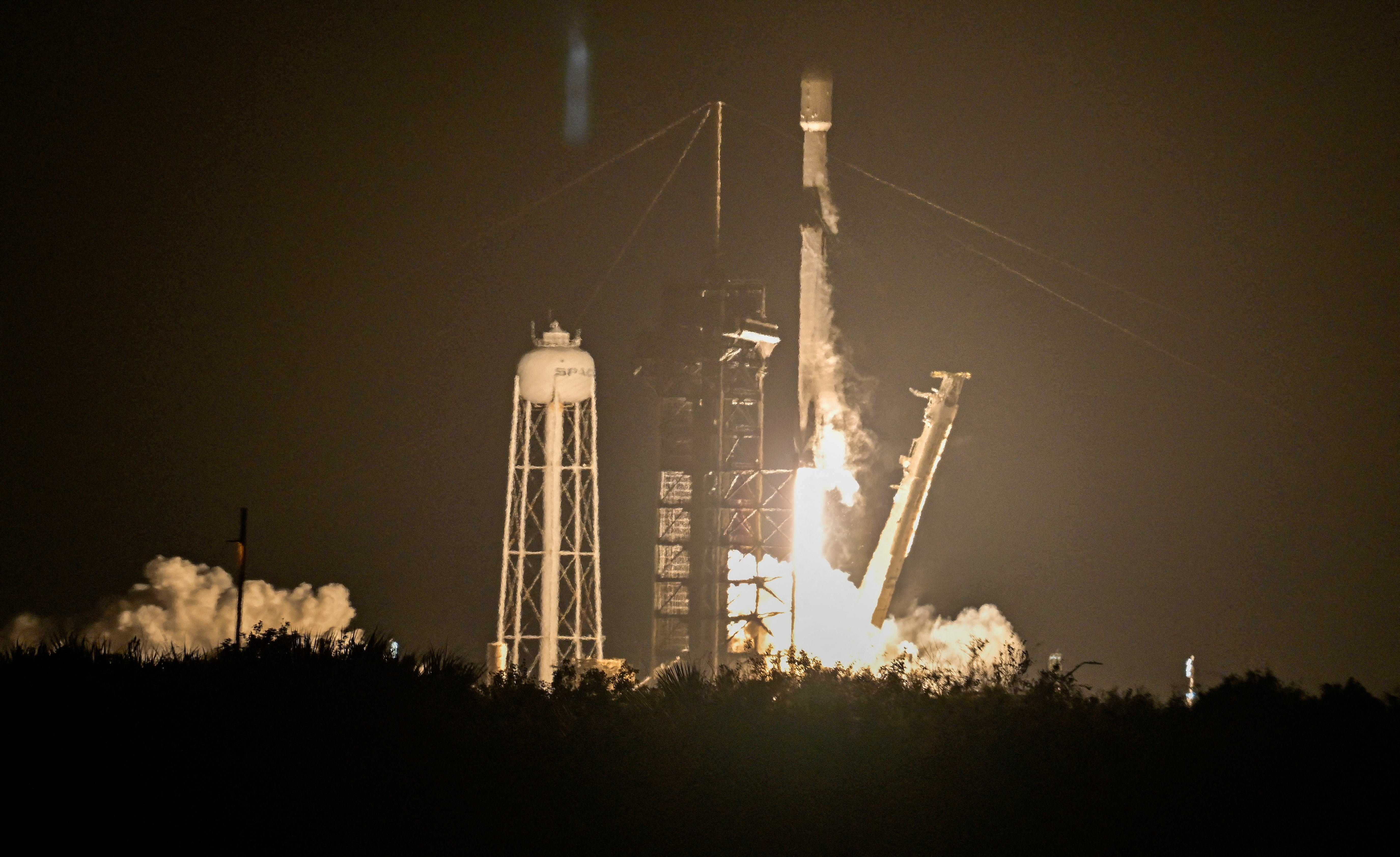 A SpaceX Falcon 9 rocket launches carrying Firefly Aerospace's Blue Ghost lunar lander as the primary payload and Japan-based ispace's Resilience lander as a secondary payload, from Kennedy Space Center in Cape Canaveral in 2025