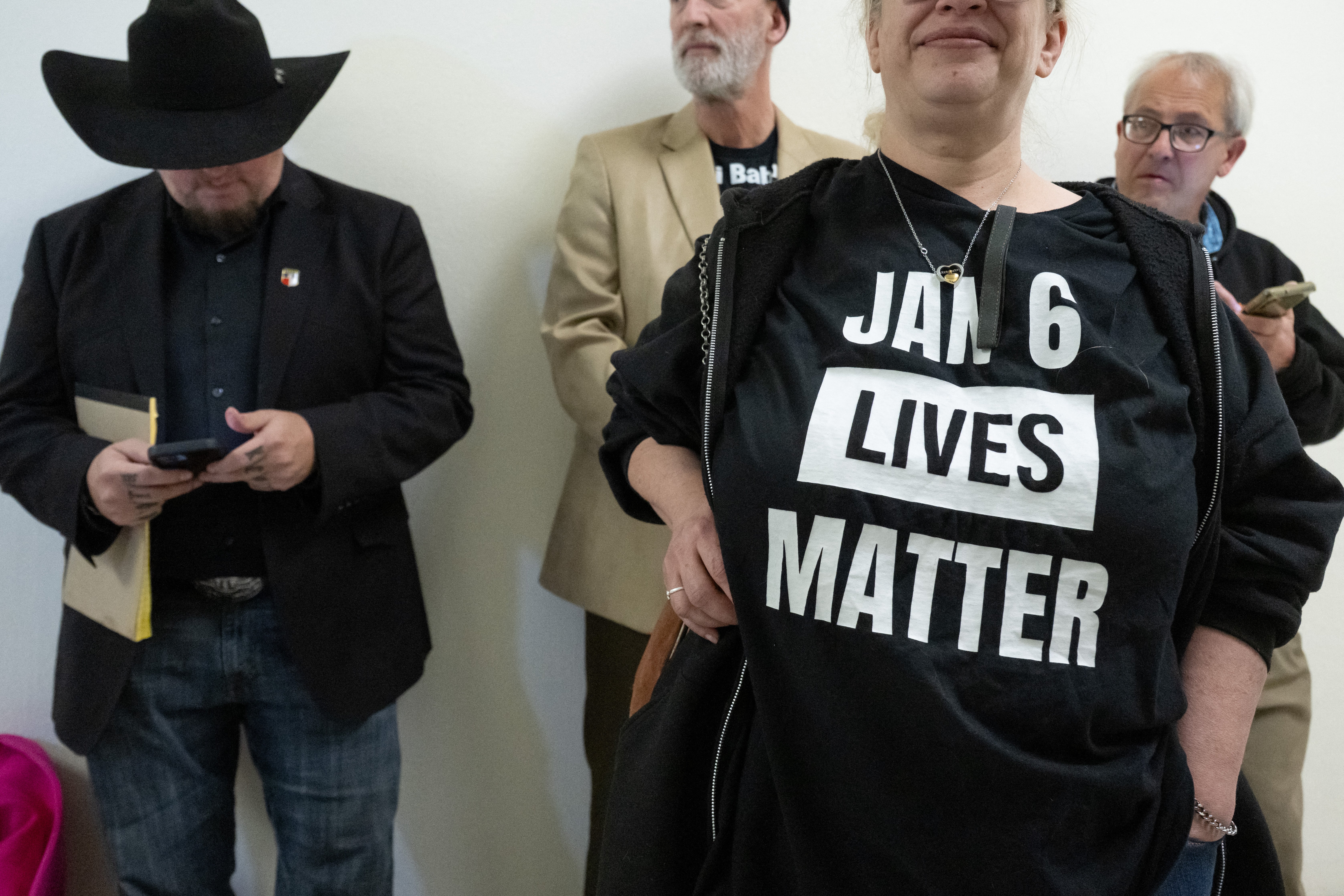 Suzzanne Monk (2R), founder of the J6 Pardon Project, and Stewart Rhodes (L), founder of the Oath Keepers who was convicted for seditious conspiracy related to the January 6, 2021 attacks on the US Capitol and later had his sentence commuted by US President Donald Trump, arrive to attend a House Judiciary Select Subcommittee