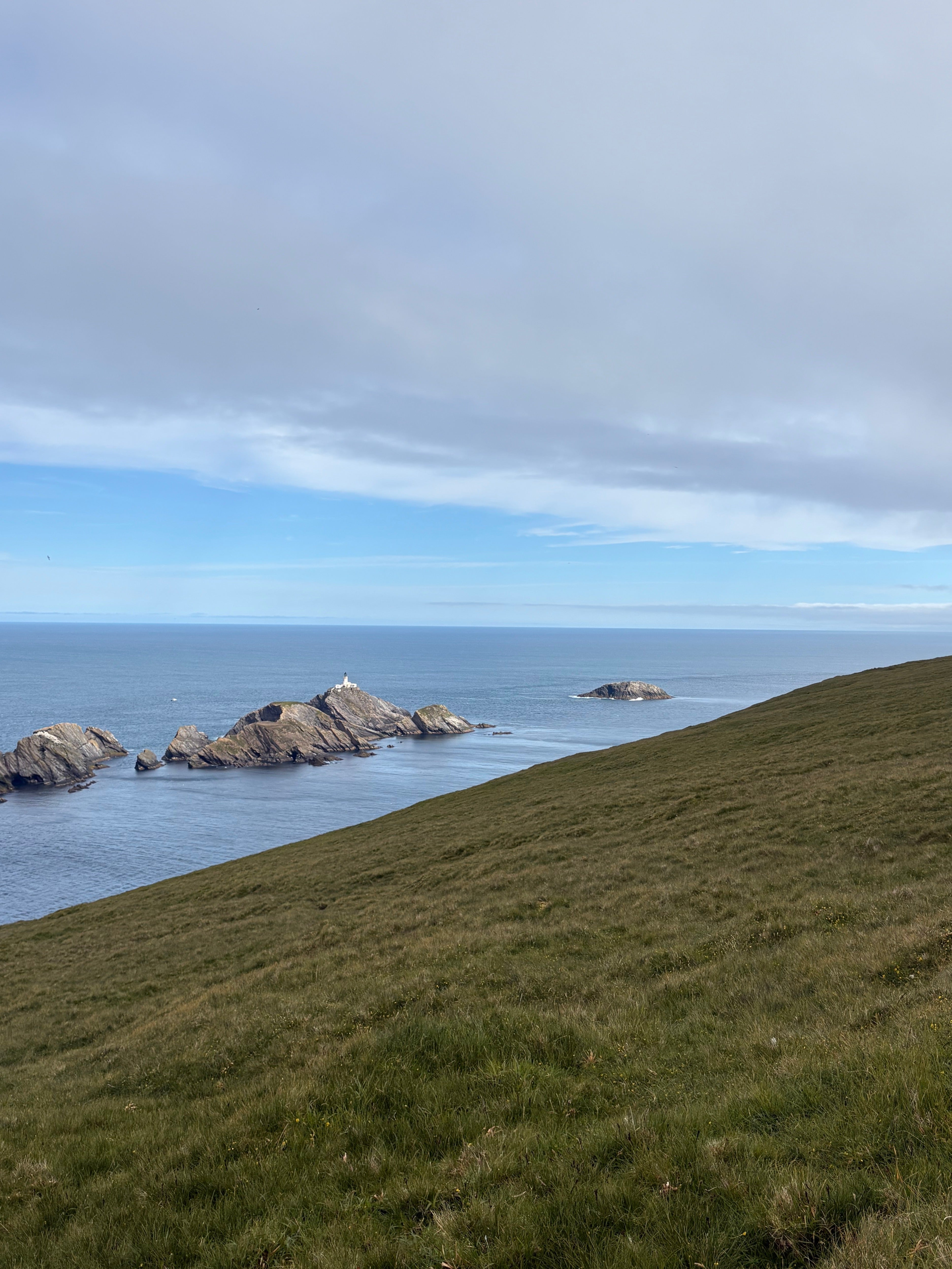 Muckle Flugga lighthouse (L) and Out Stack, the northernmost point in the British Isles (R)