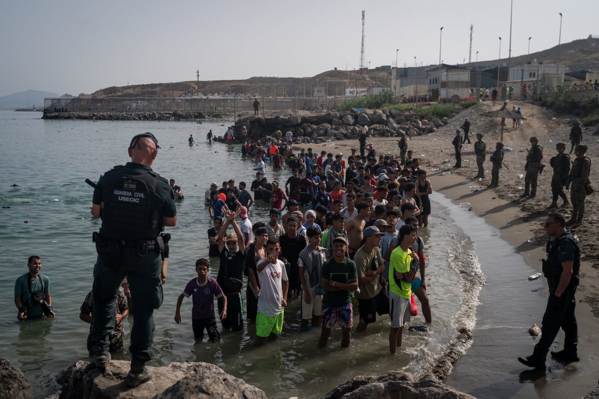 Spanish police ‘identify multiple suspected jihadists’ among 60,000 migrants who stormed border into Ceuta