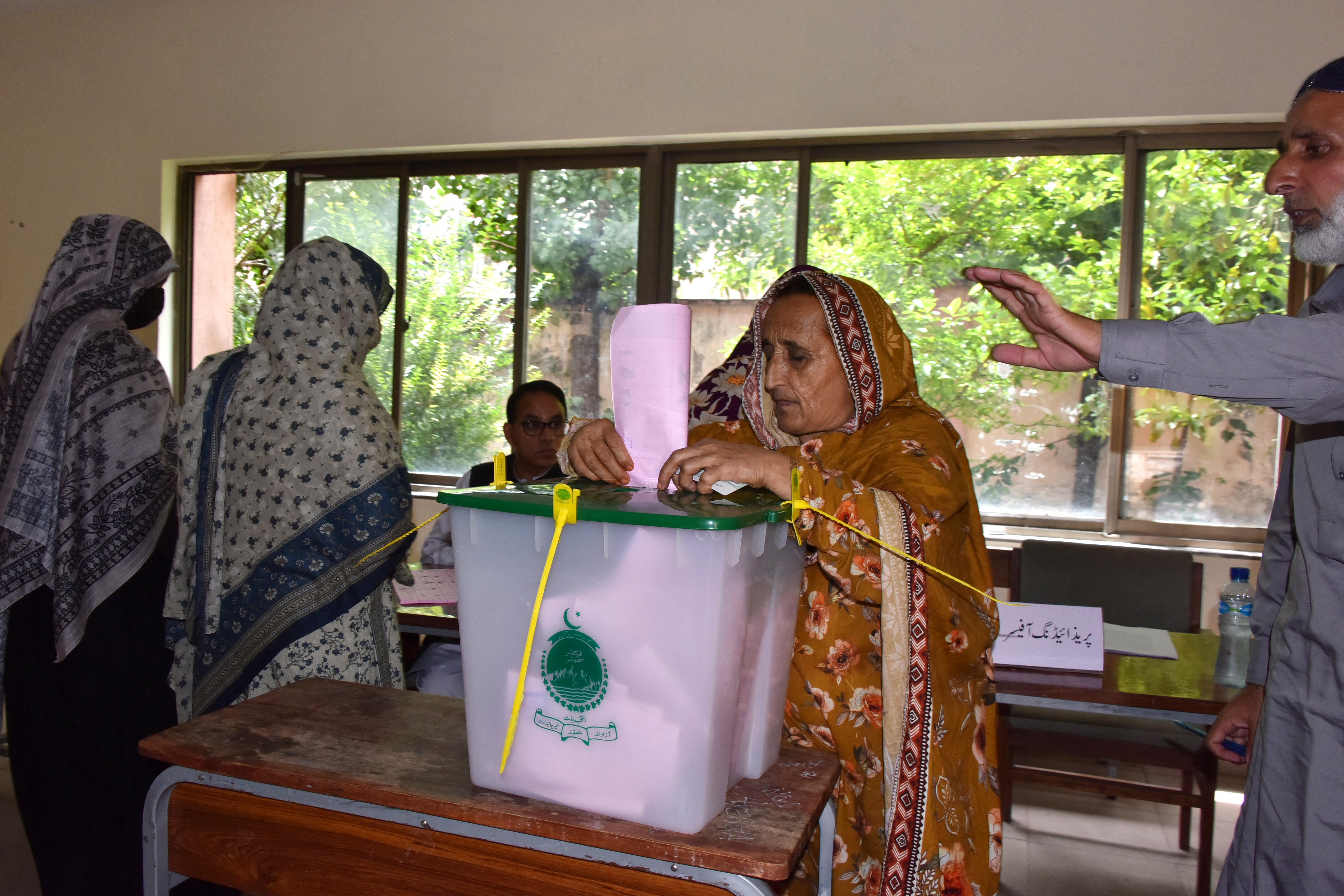 A woman votes in the second phase of the legislative assembly election in Muzaffarabad on 2 August 2026