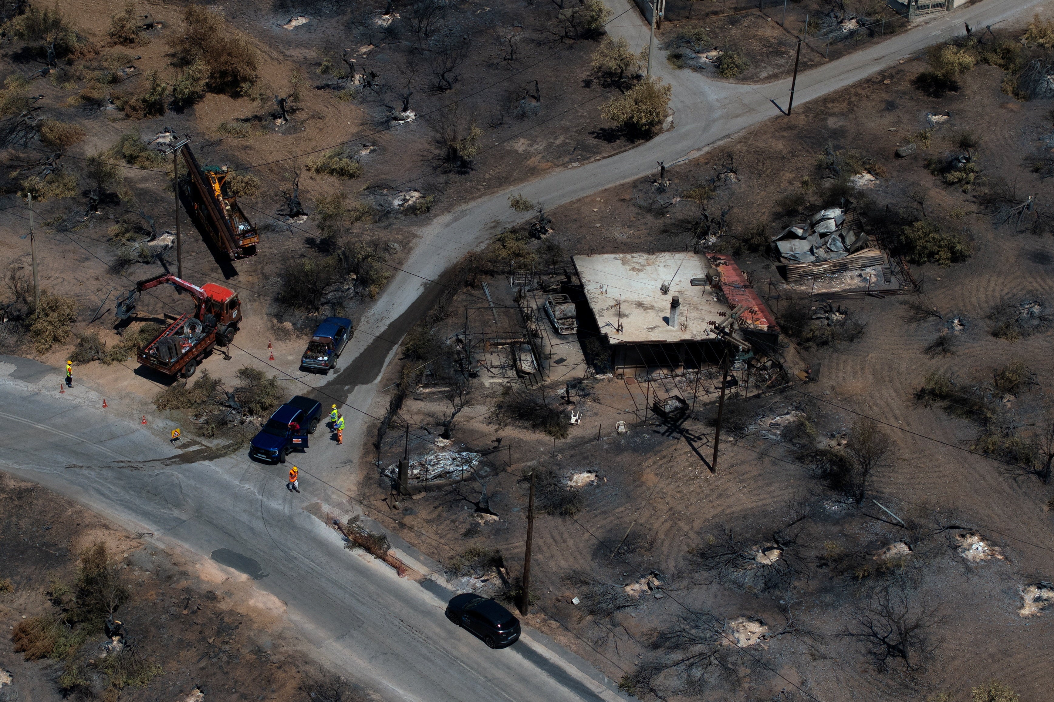 A drone view of a burnt building after a wildfire in Porto Germeno, Greece, 5 August 2026