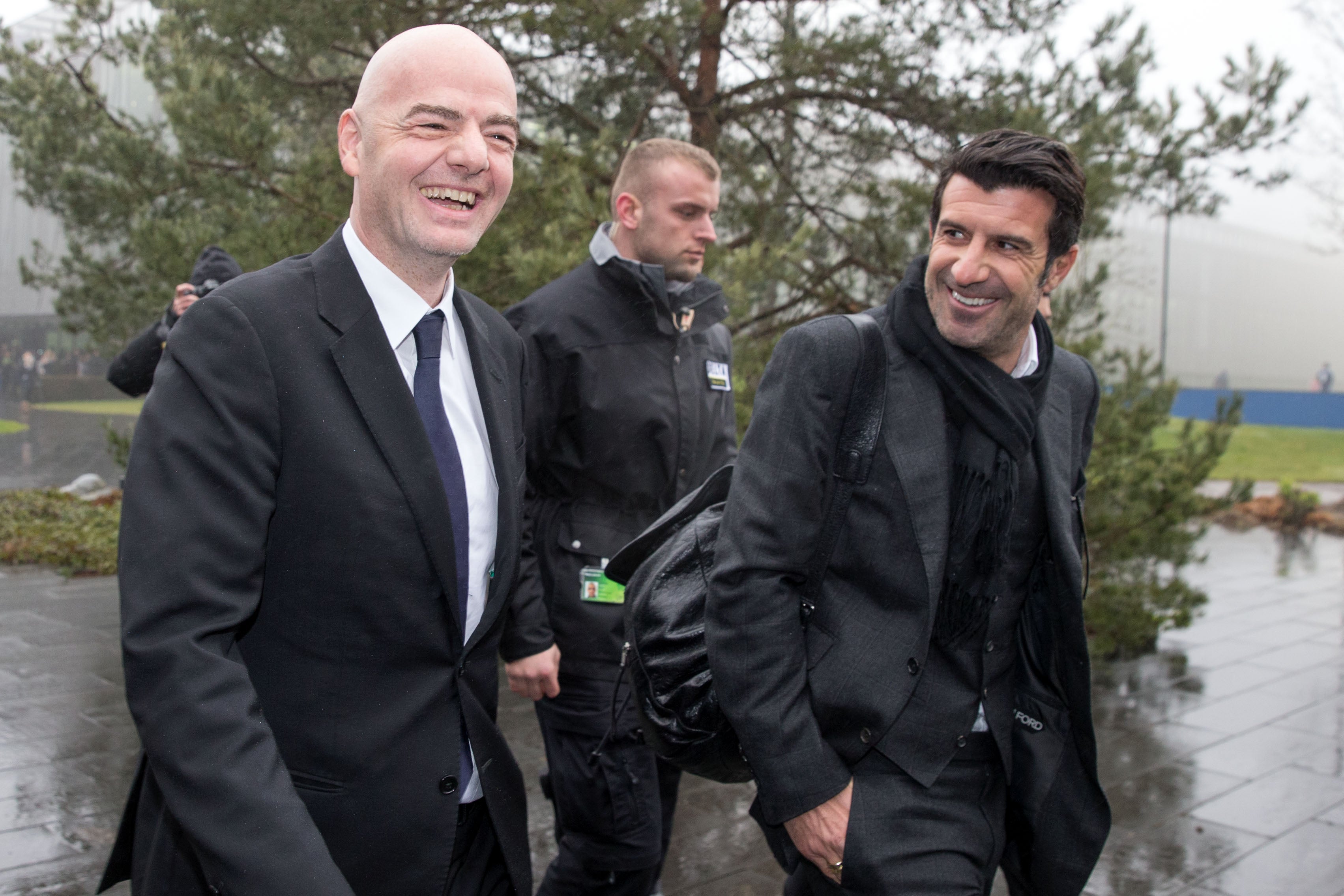 Luis Figo (right) has called for Gianni Infantino to resign as Fifa president
