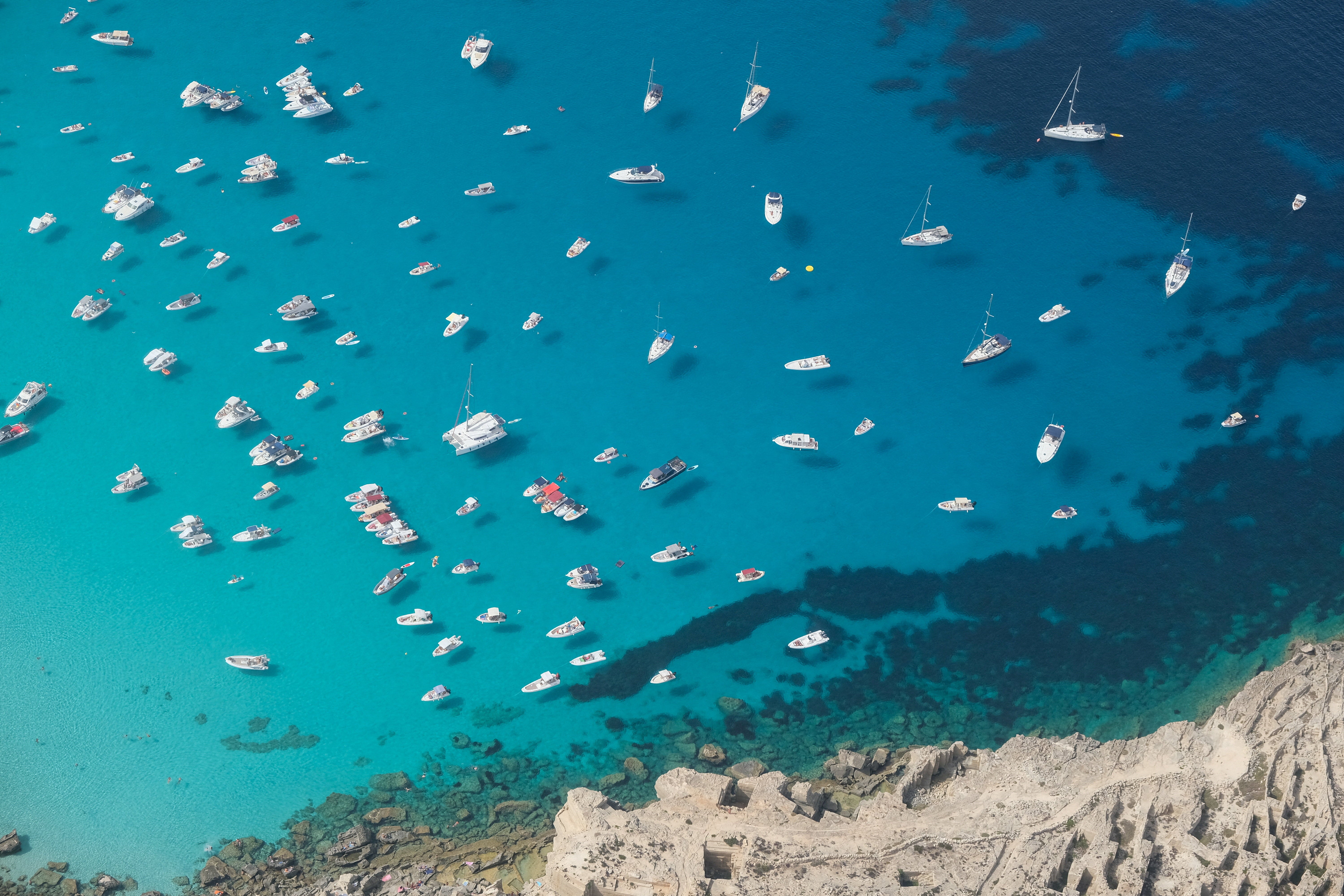 Boats gather in the waters off Favignana