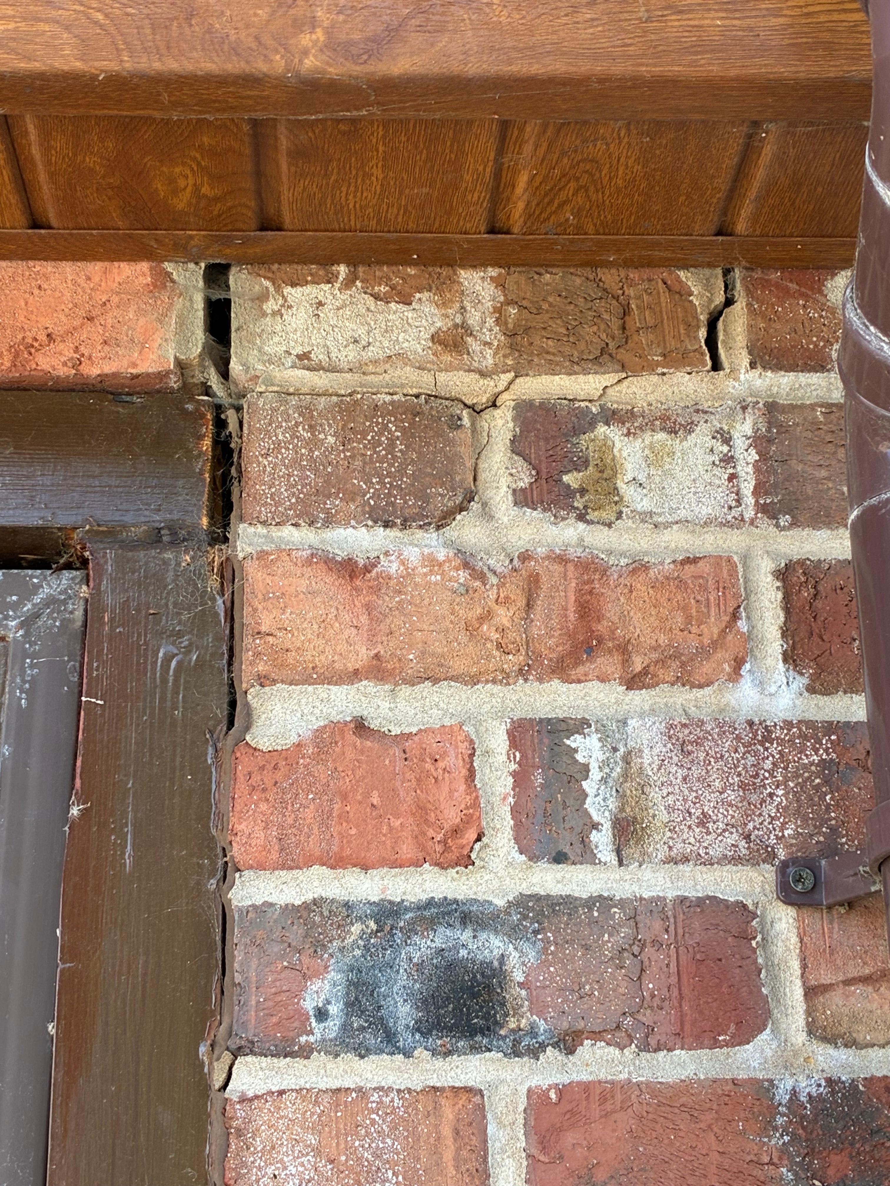 Cracks also began appearing in the bricks and mortar in the garage walls at the property (Kaye Brown)