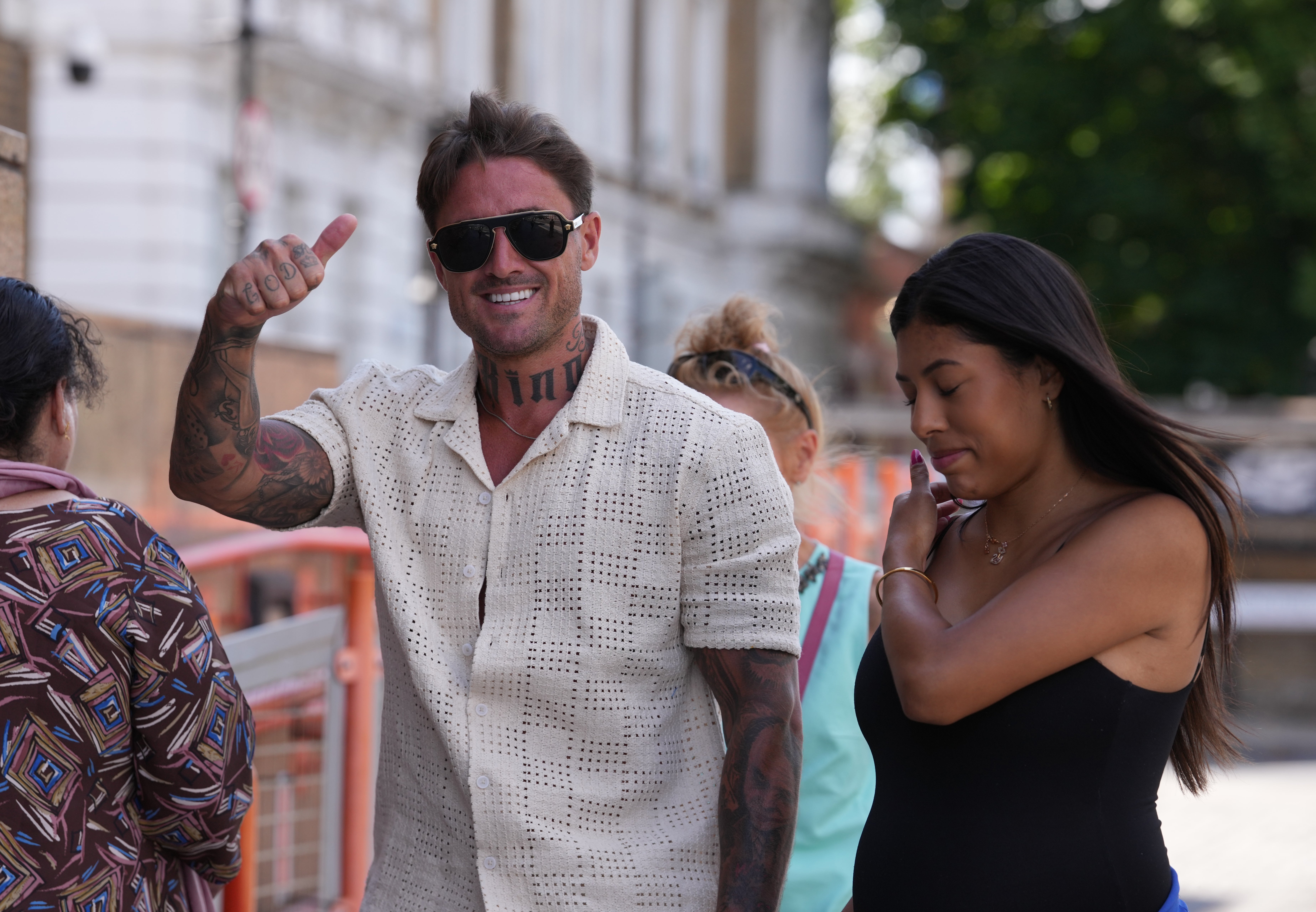 Stephen Bear arrives at Thames Magistrates' Court, east London, with his partner, Miami (PA)