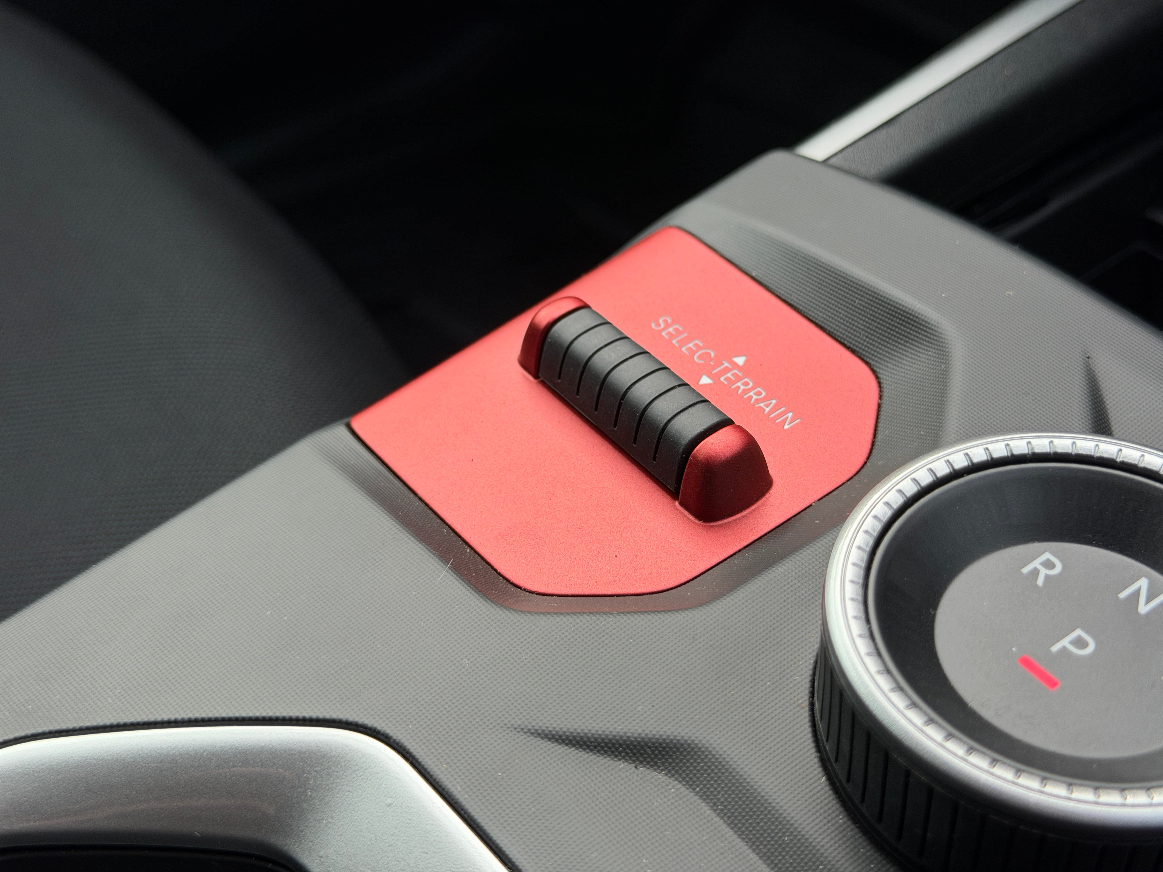There are plenty of neat, rugged touches around the Jeep Compass's cabin, including this switch to change the car's terrain settings (Steve Fowler)