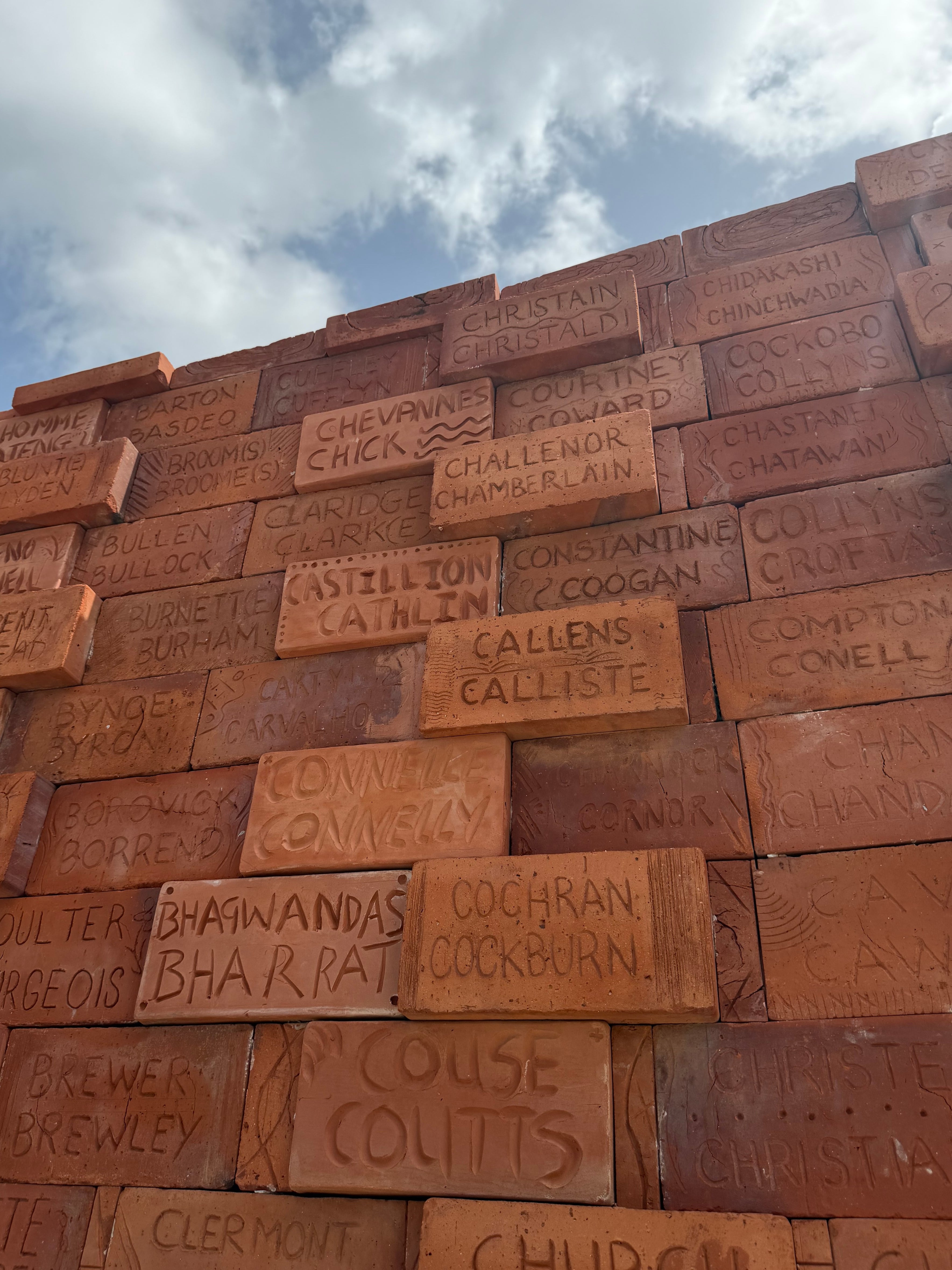 The Clarkes find their name at the Builders of Barbados Wall (Angelina Villa-Clarke)