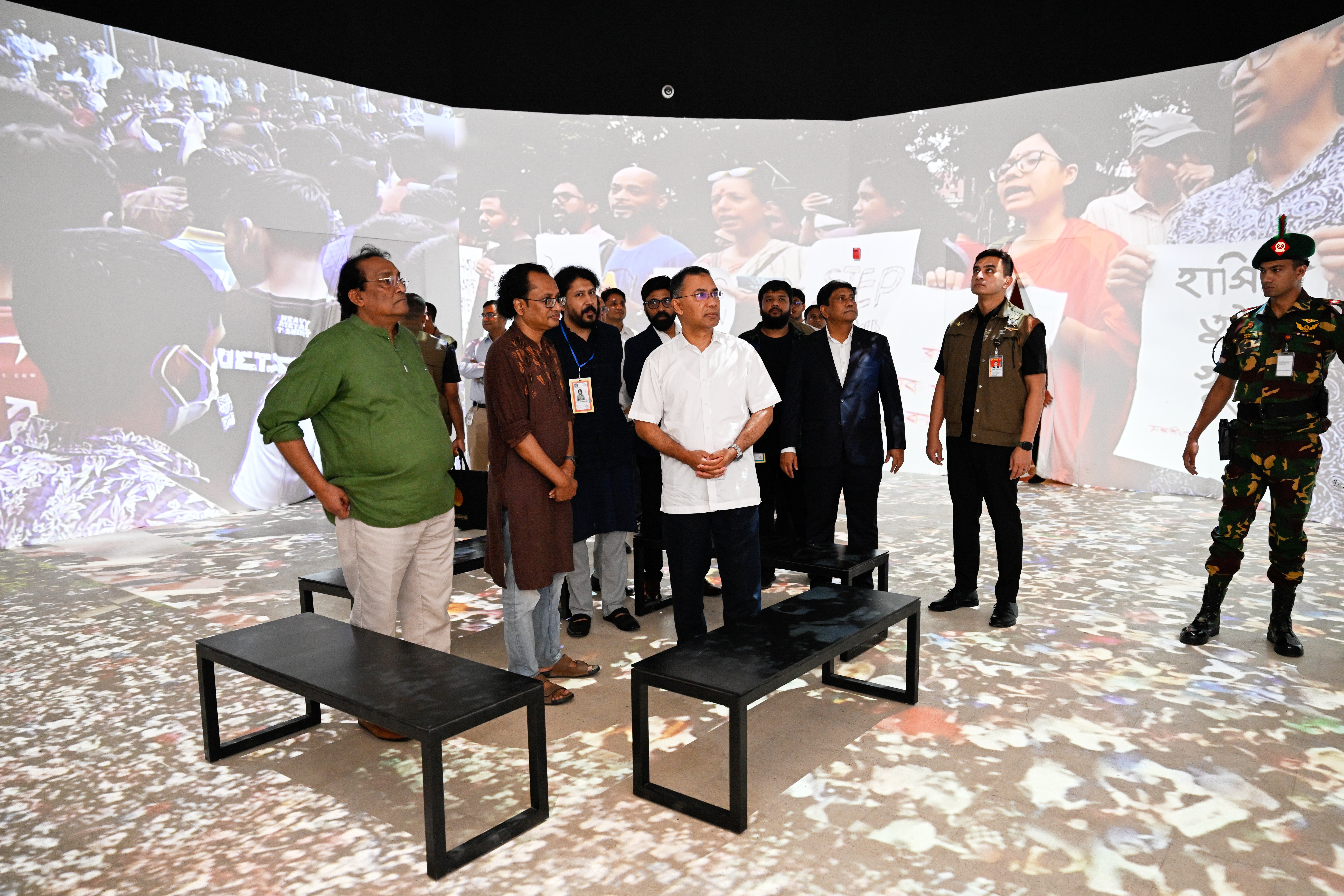 Bangladesh's prime minister Tarique Rahman, centre, looks at an exhibit at the inauguration of a museum which will serve as a memorial for those killed during the mass uprisings in July 2024, at the former residence of Bangladesh's ousted leader Sheikh Hasina, in Dhaka, Bangladesh, Wednesday, 5 August 2026 (AP)