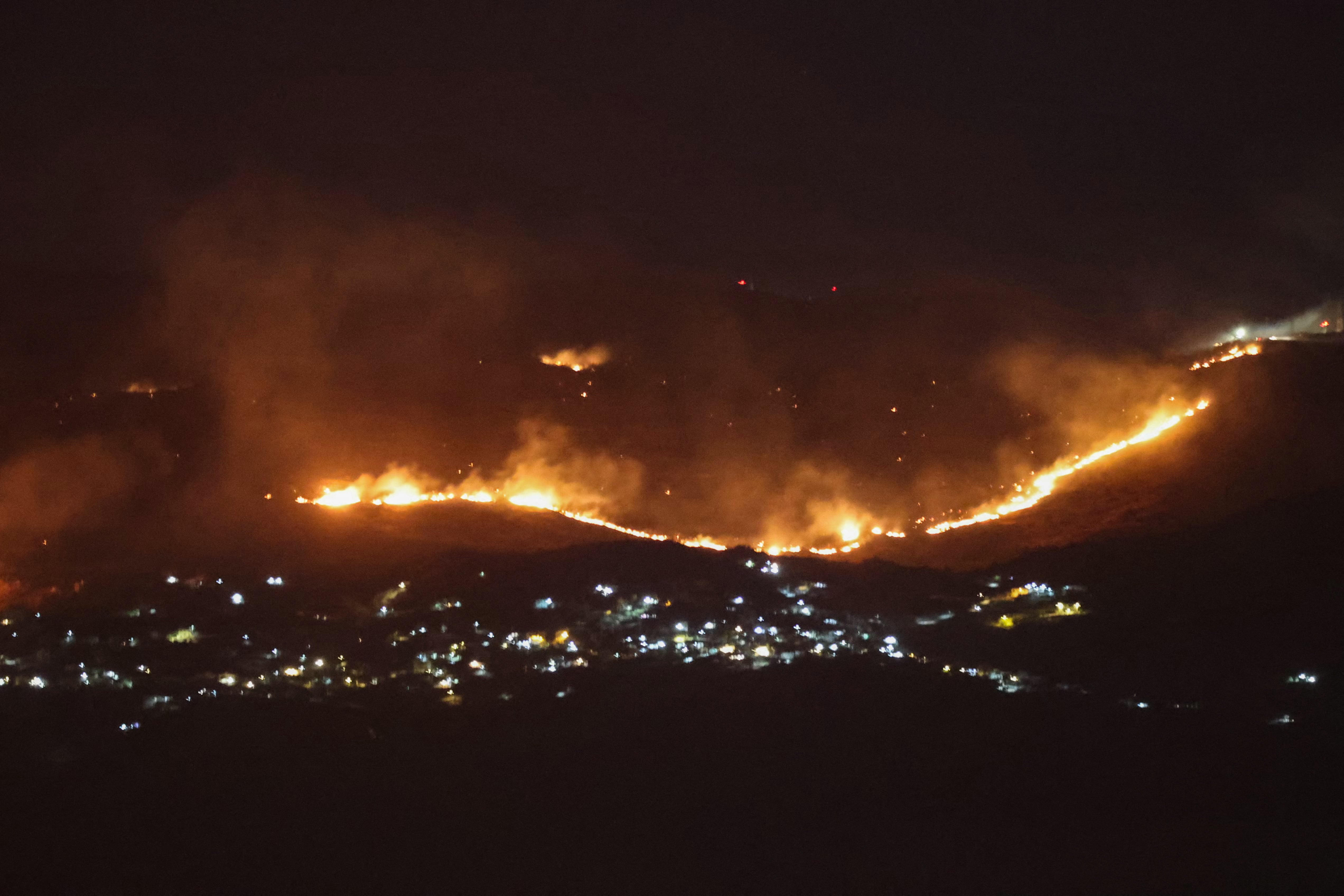 Forest fires sweep through the outskirts of the southern village of Kfar Shouba as a result of Israeli shelling that targeted the area, as seen from the southern Lebanese area of Marjayoun (AFP/Getty)