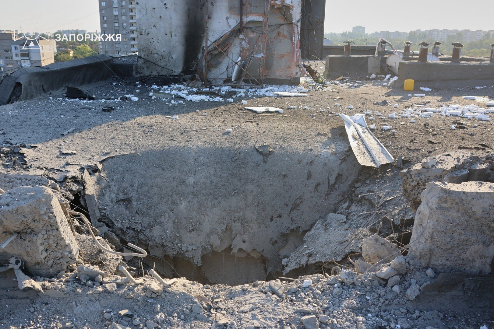 In this photo provided by the Ukrainian Emergency Service, a residential building is damaged following a Russian air attack in Zaporizhzhia, Ukraine,