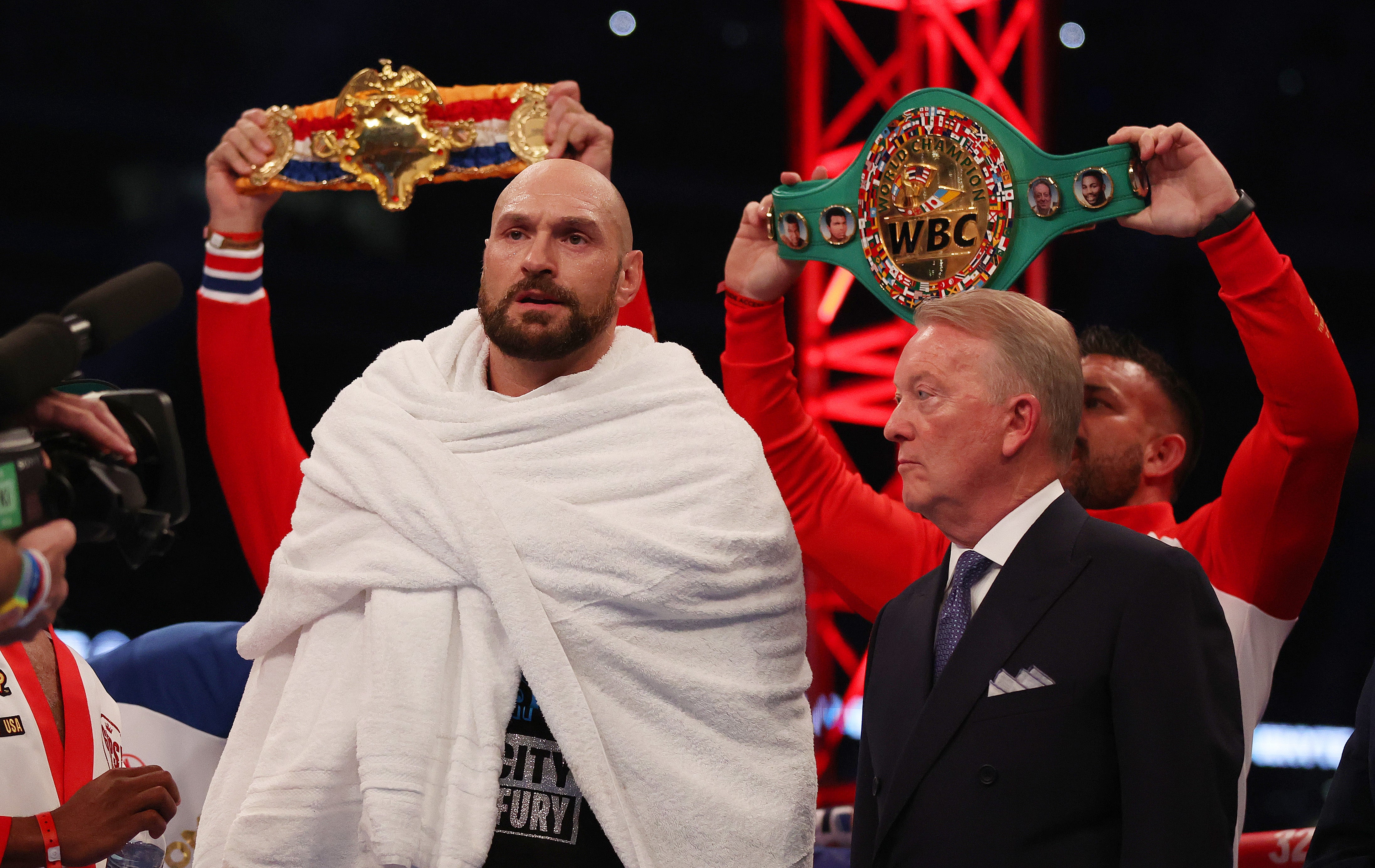Tyson Fury (left) with his promoter Frank Warren at Wembley in 2022