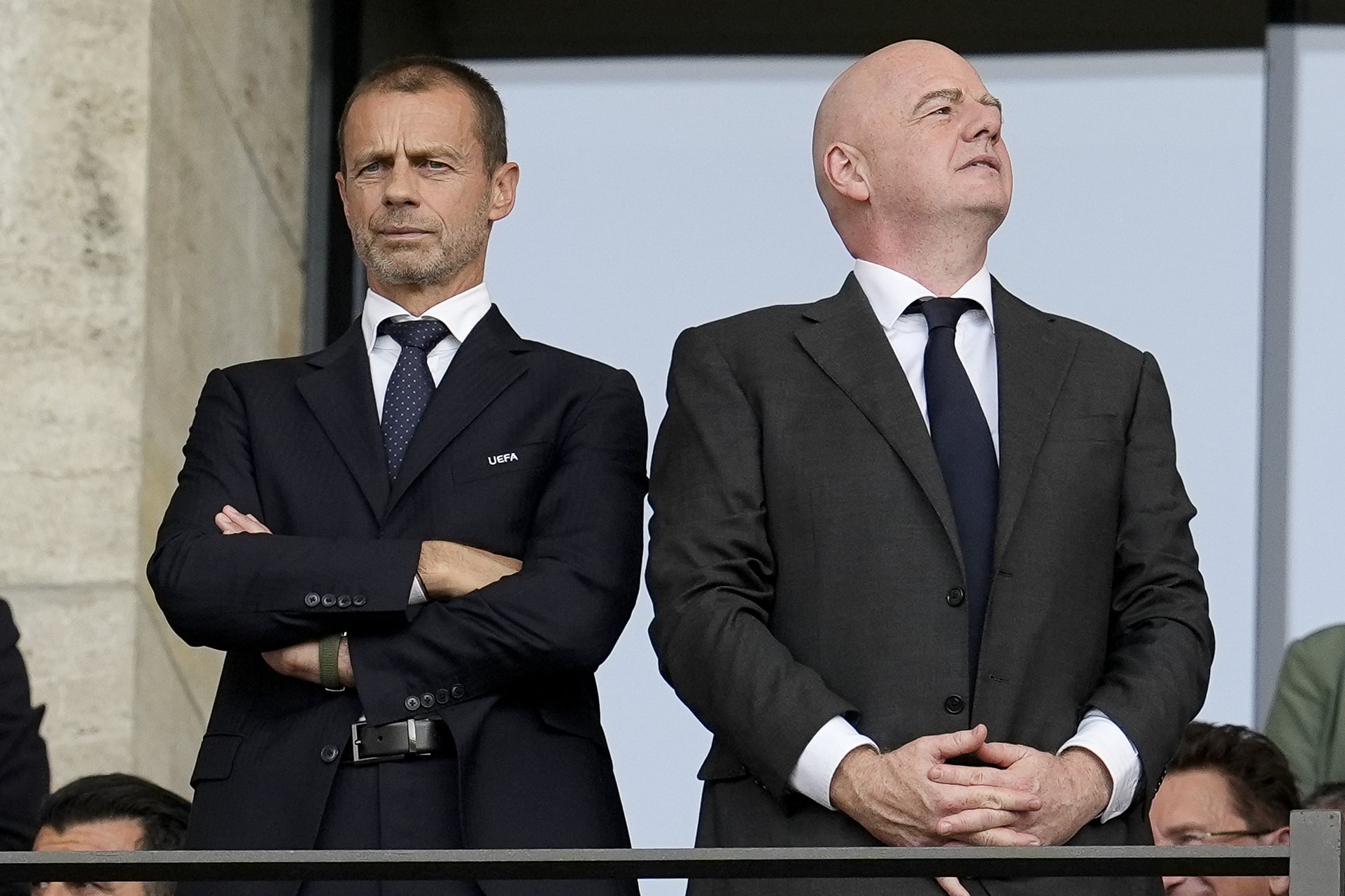 Uefa boss Aleksander Ceferin (left) has ruled out challenging Gianni Infantino (PA)