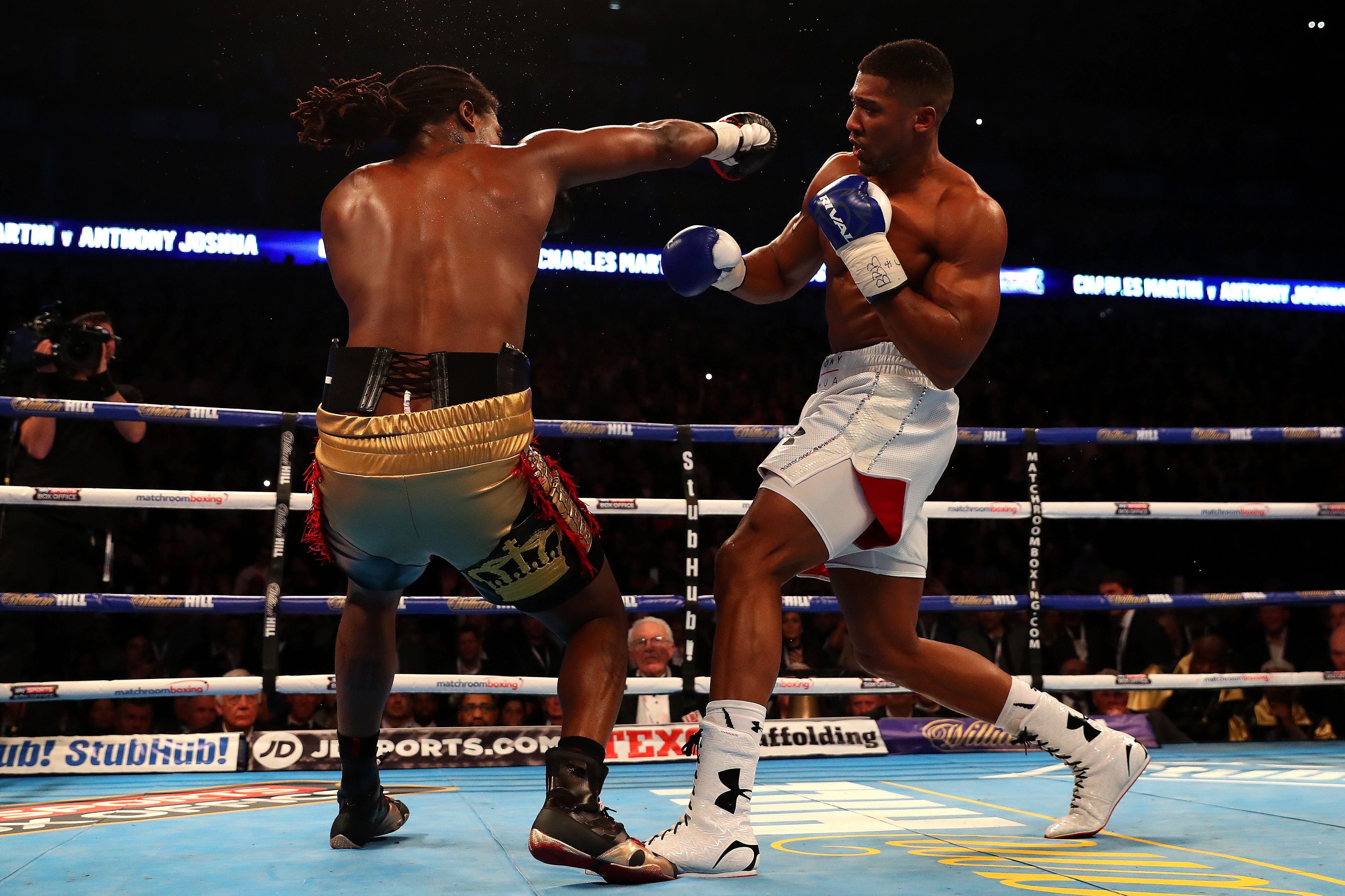 Anthony Joshua (right) stopped Charles Martin to become a world champion in 2016