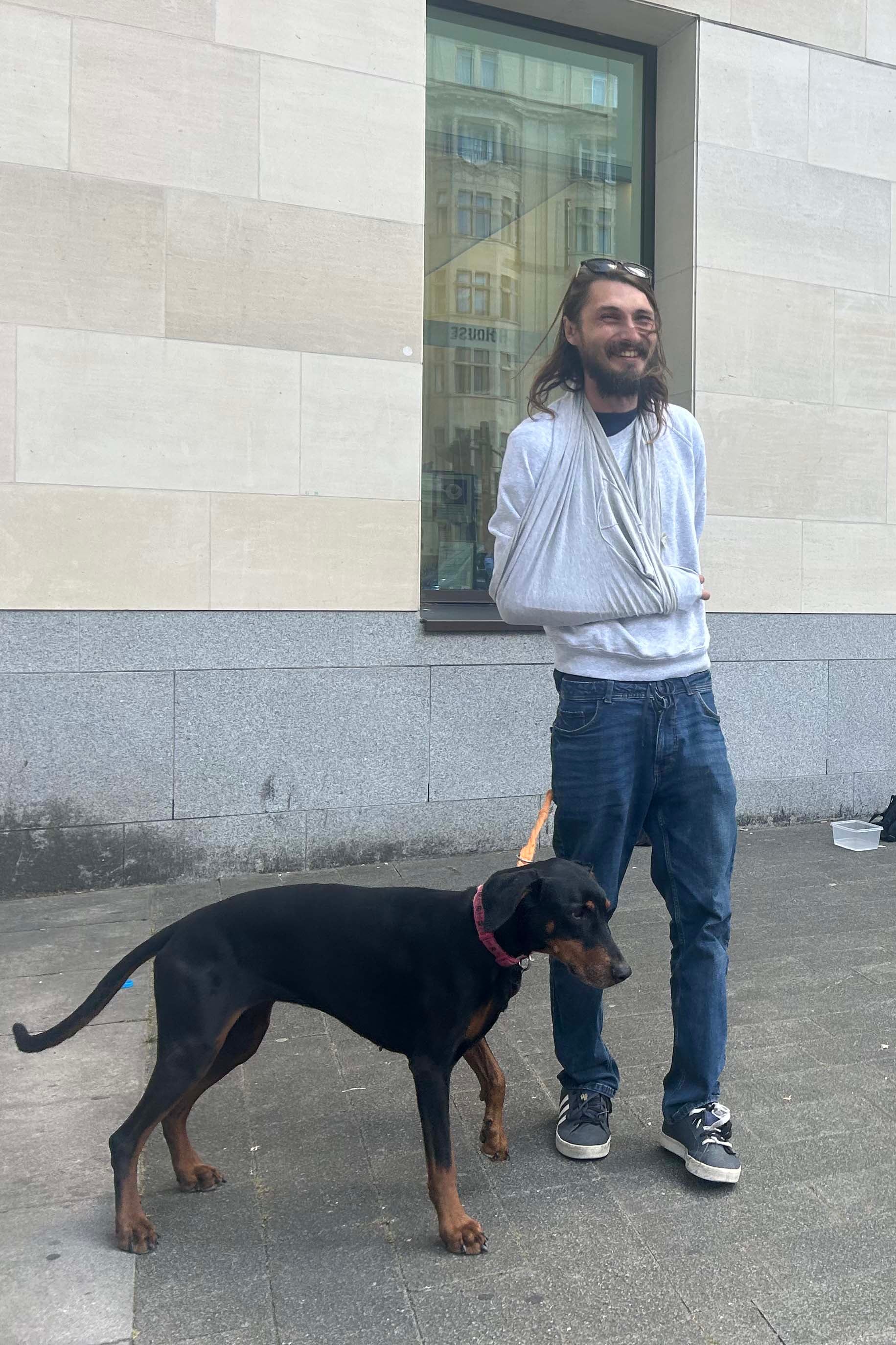 Alex Jenkinson, 39, stands outside Westminster Magistrates' Court with his dog, Indie. (PA)