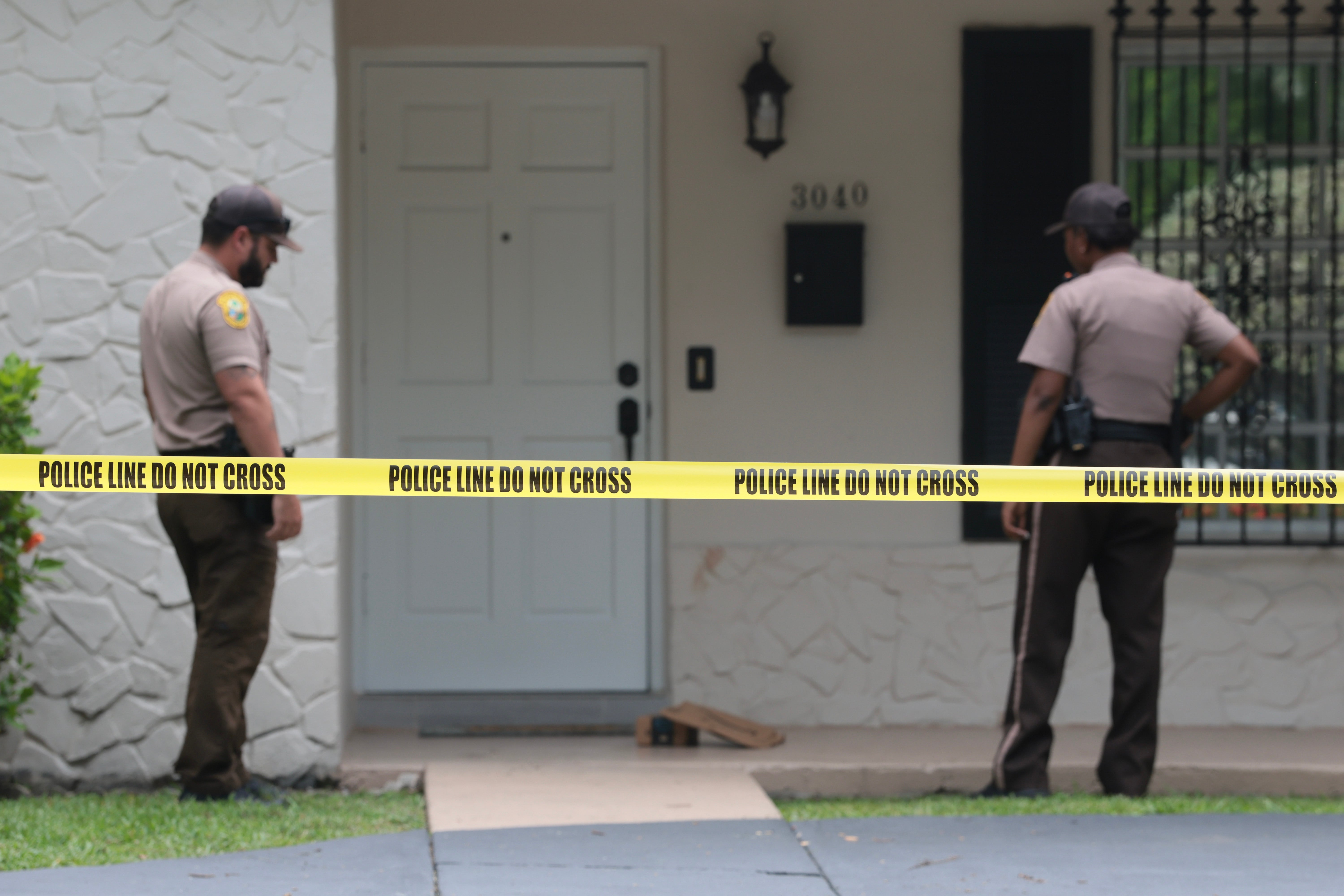 Police officers outside Hilton’s home