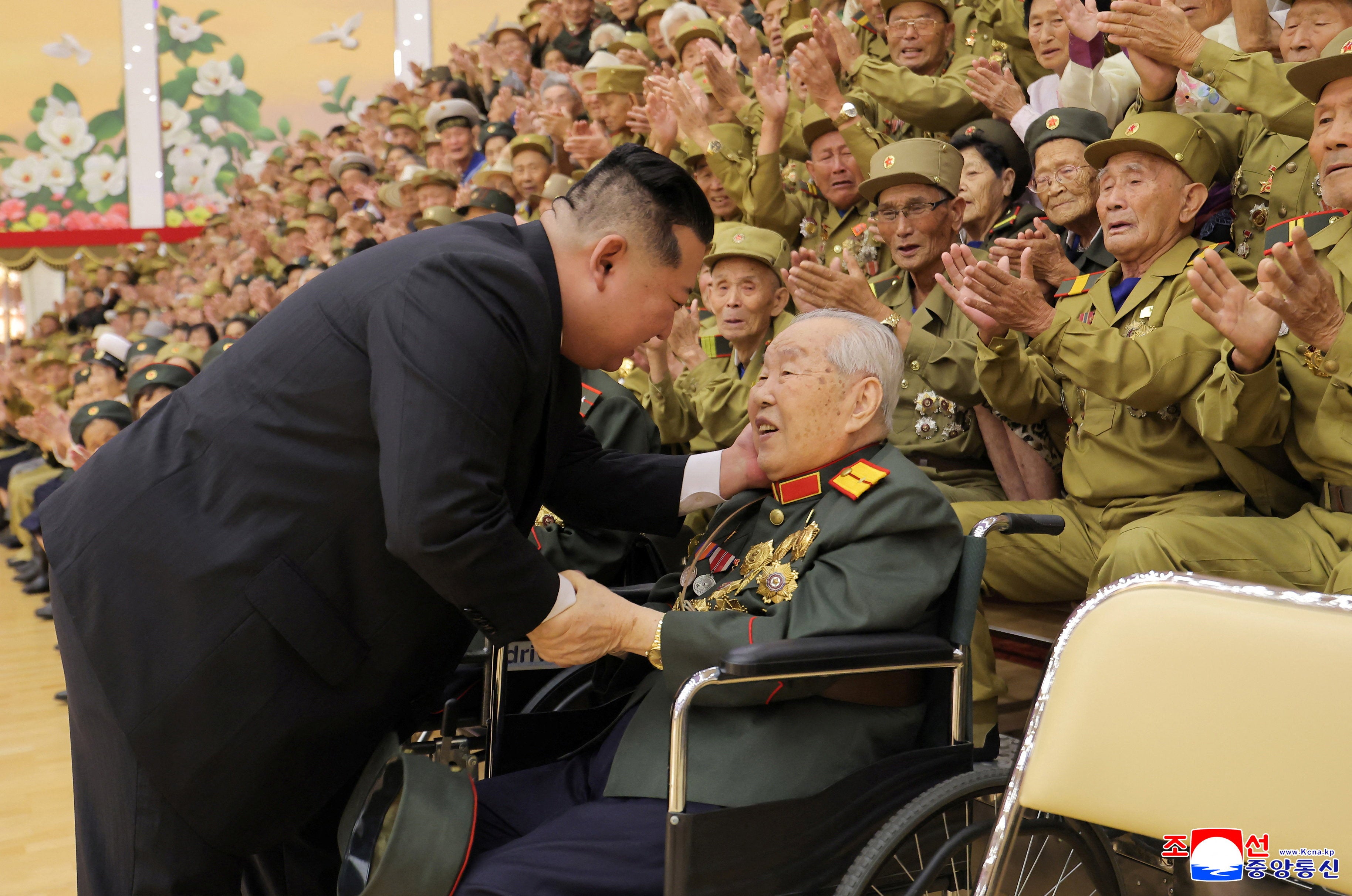 North Korean leader Kim Jong Un participates in a meeting with war veterans who had taken part in events marking the 73rd anniversary of the Korean War armistice, in Pyongyang, North Korea, July 28