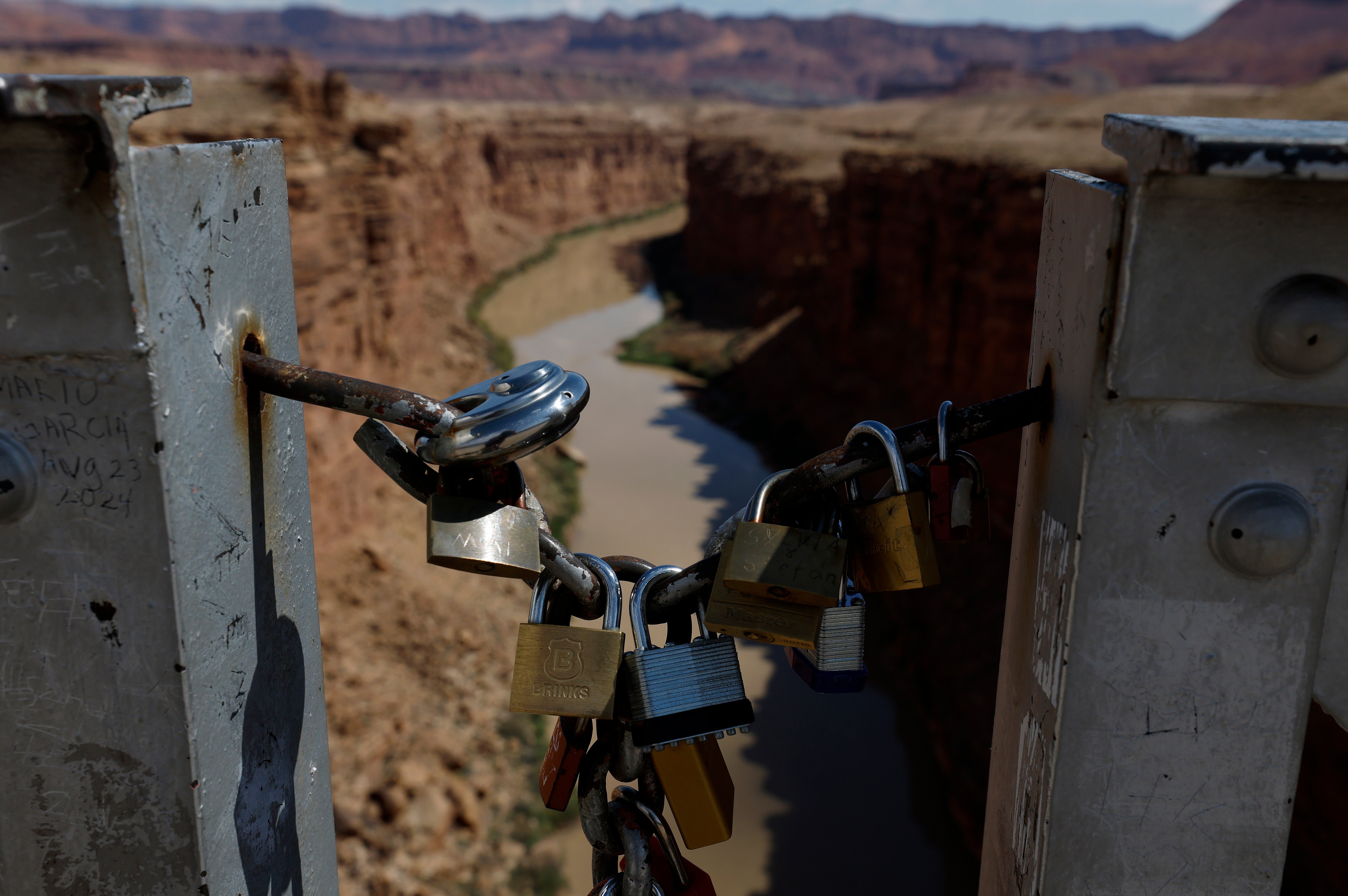 Love locks are seen on the historic Navajo Bridge over the Colorado River on July 31, 2026 in Marble Canyon, Arizona
