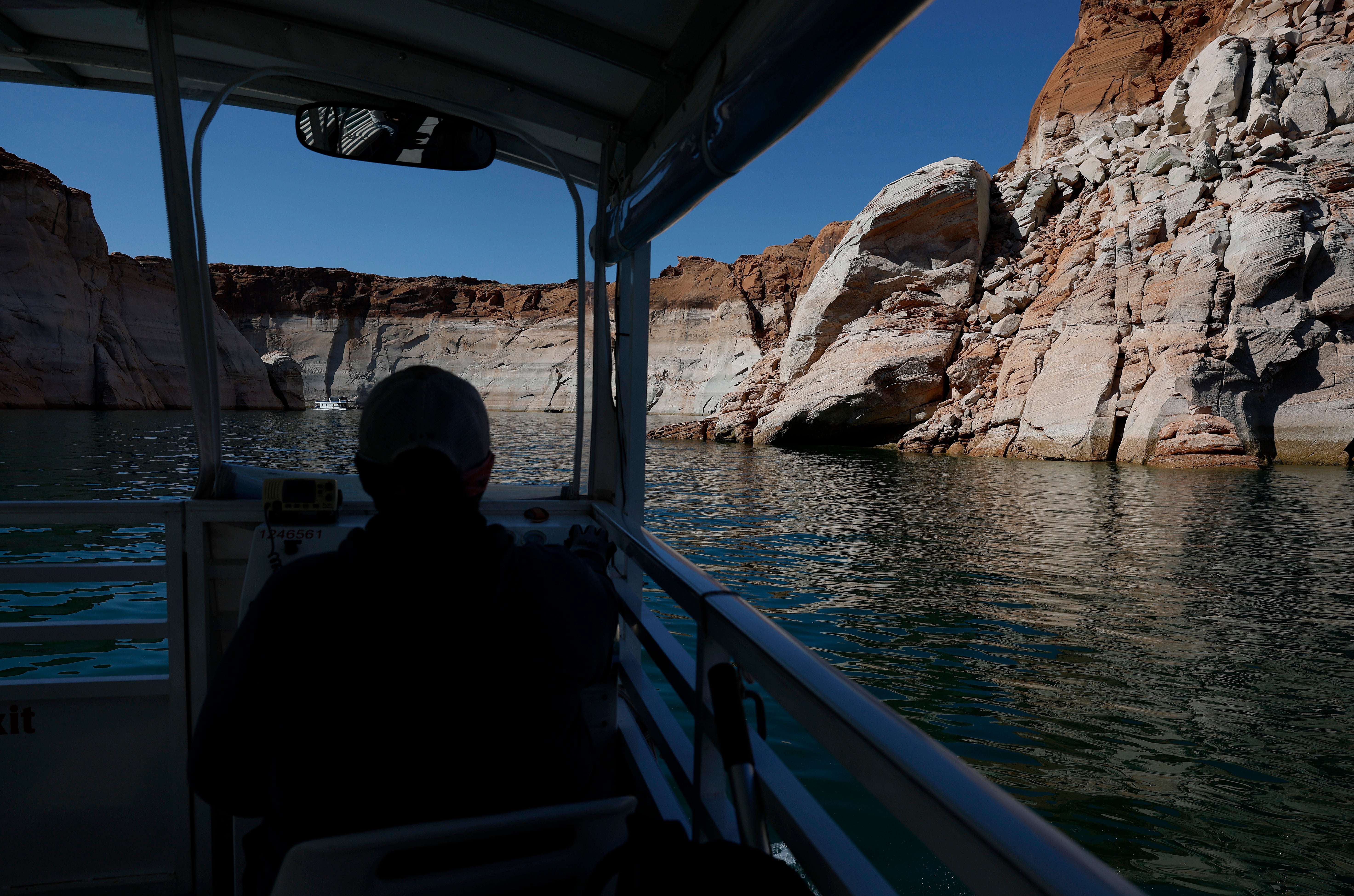 The tall bleached ''bathtub ring'' is visible on the rocky banks of Lake Powell