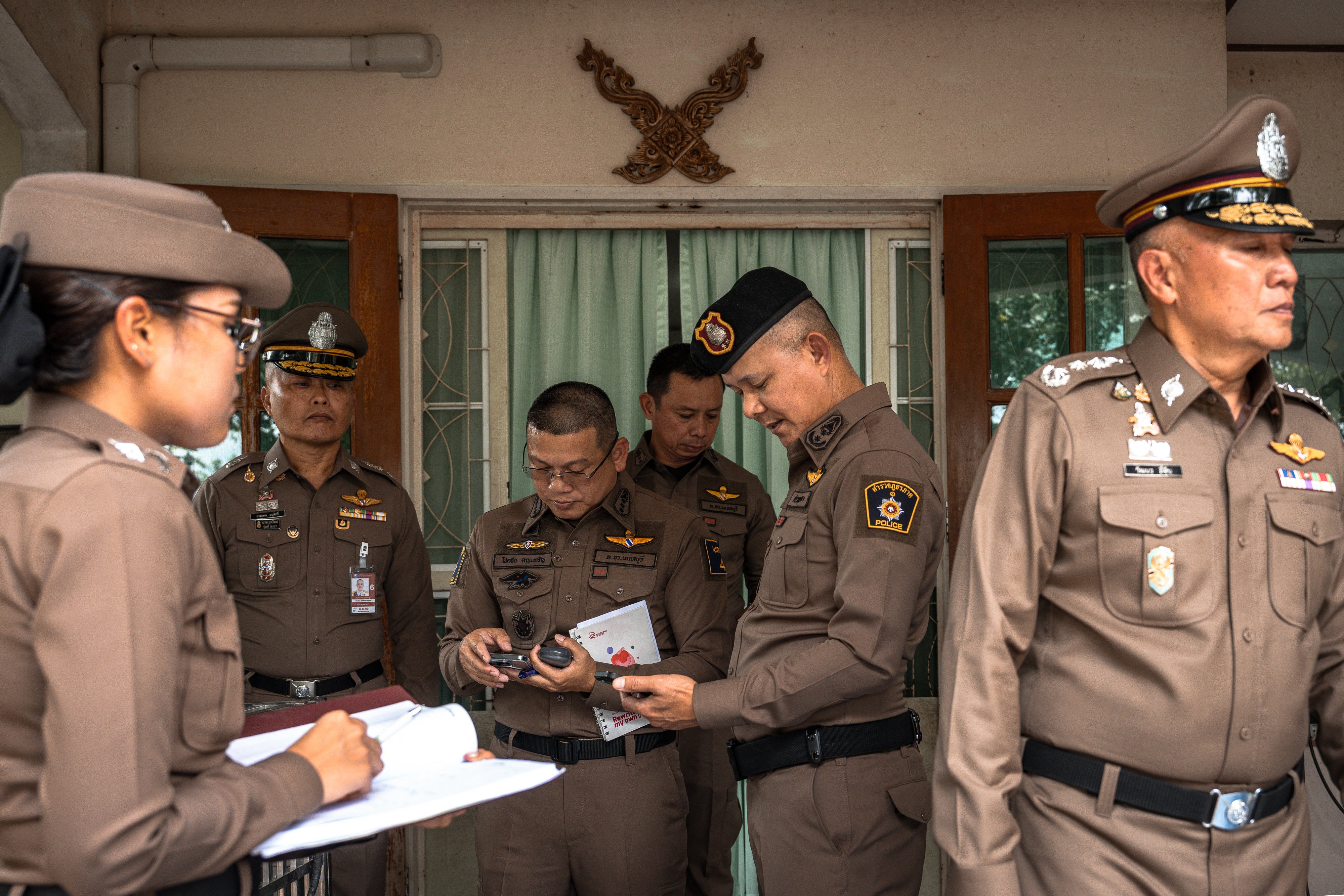 Police gather outside the house where a teenage suspect is suspected of killing his grandparents before carrying out a school shooting in Nonthaburi province, north of Thailand'