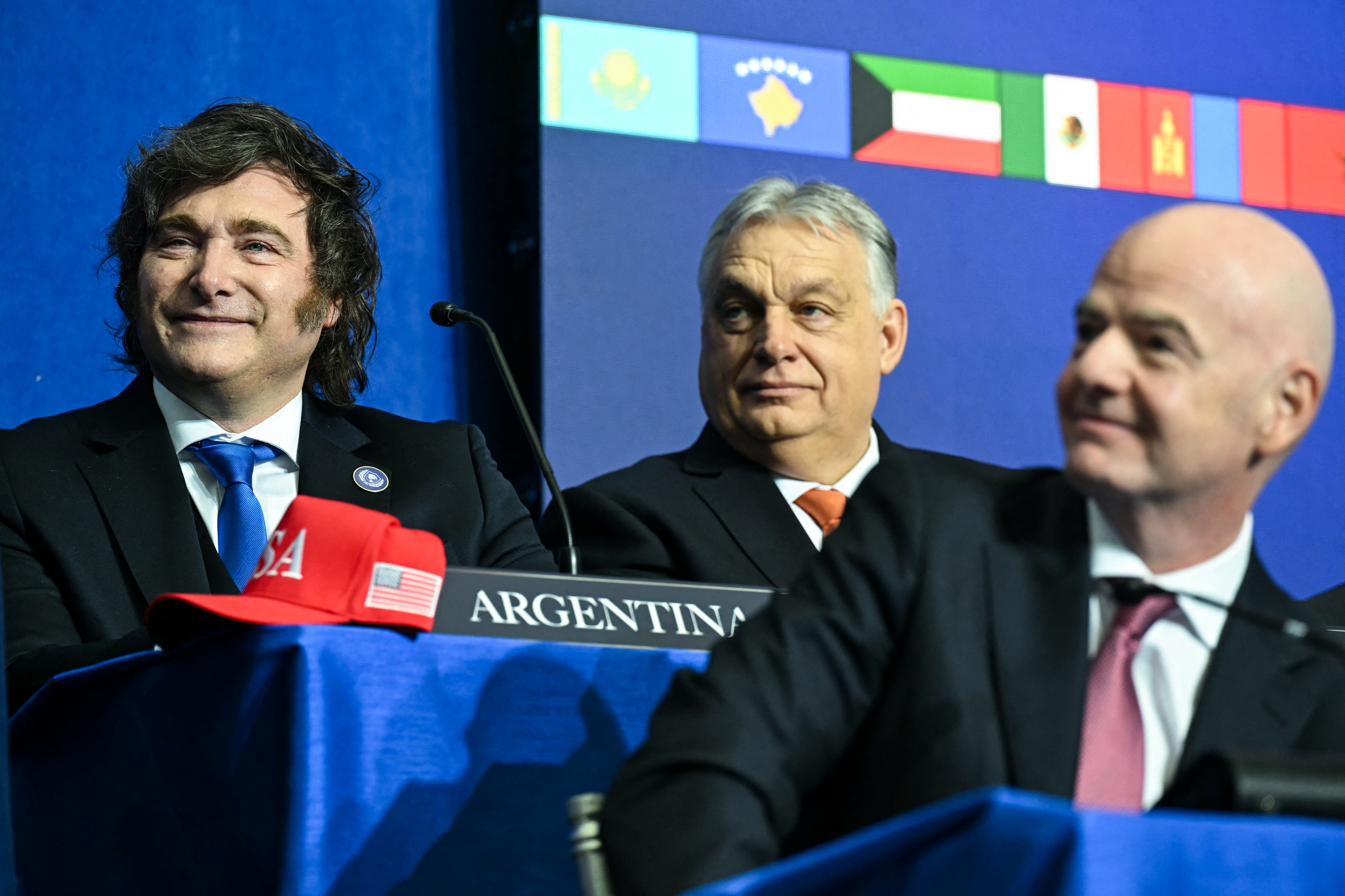 Argentina president Javier Milei (left) behind Infantino at the 