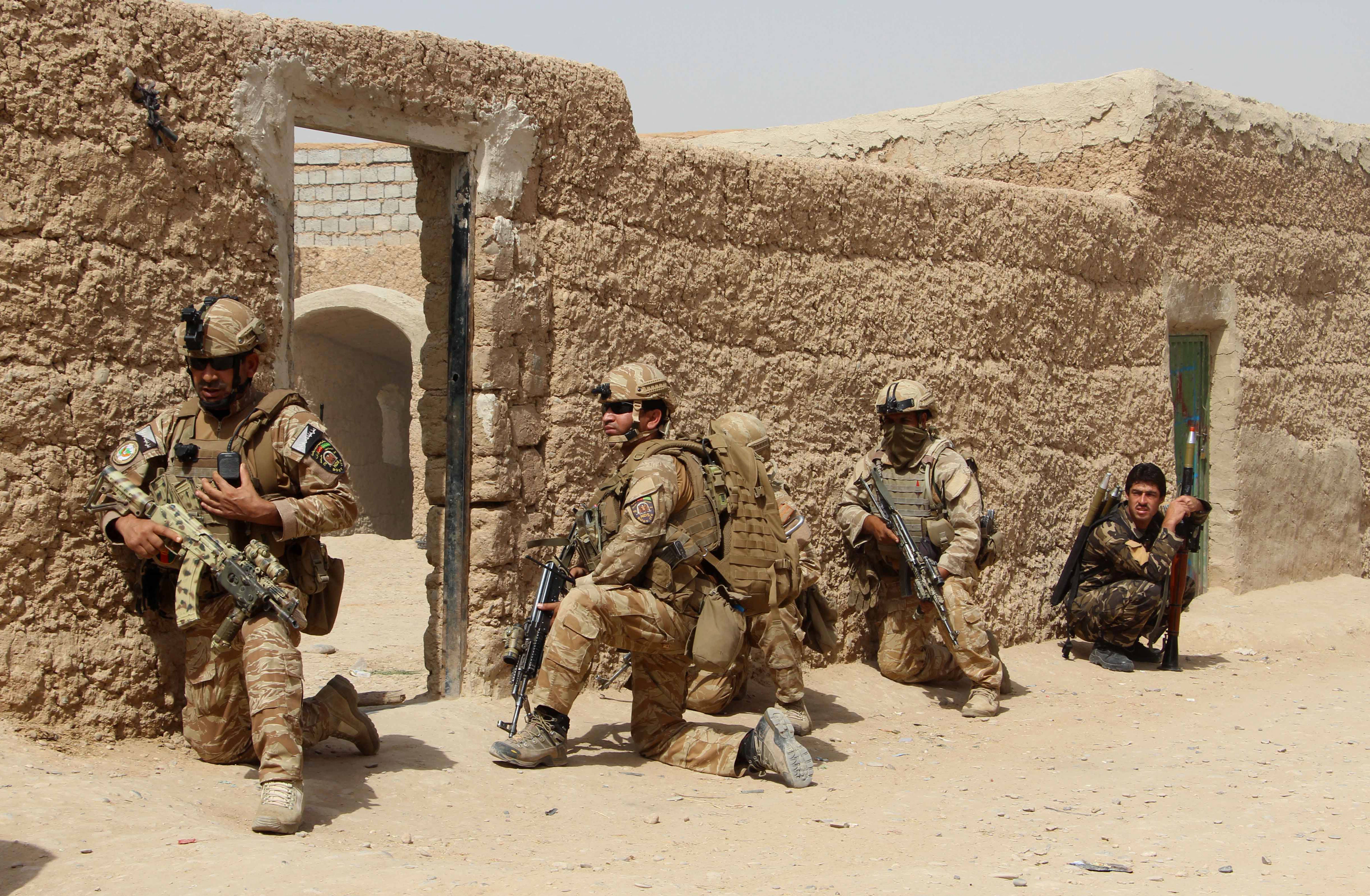 Afghan National Army commandos take position during a military operation in Helmand province in October 2016. Former security personnel are now at risk of persecution from the Taliban (AFP via Getty Images)