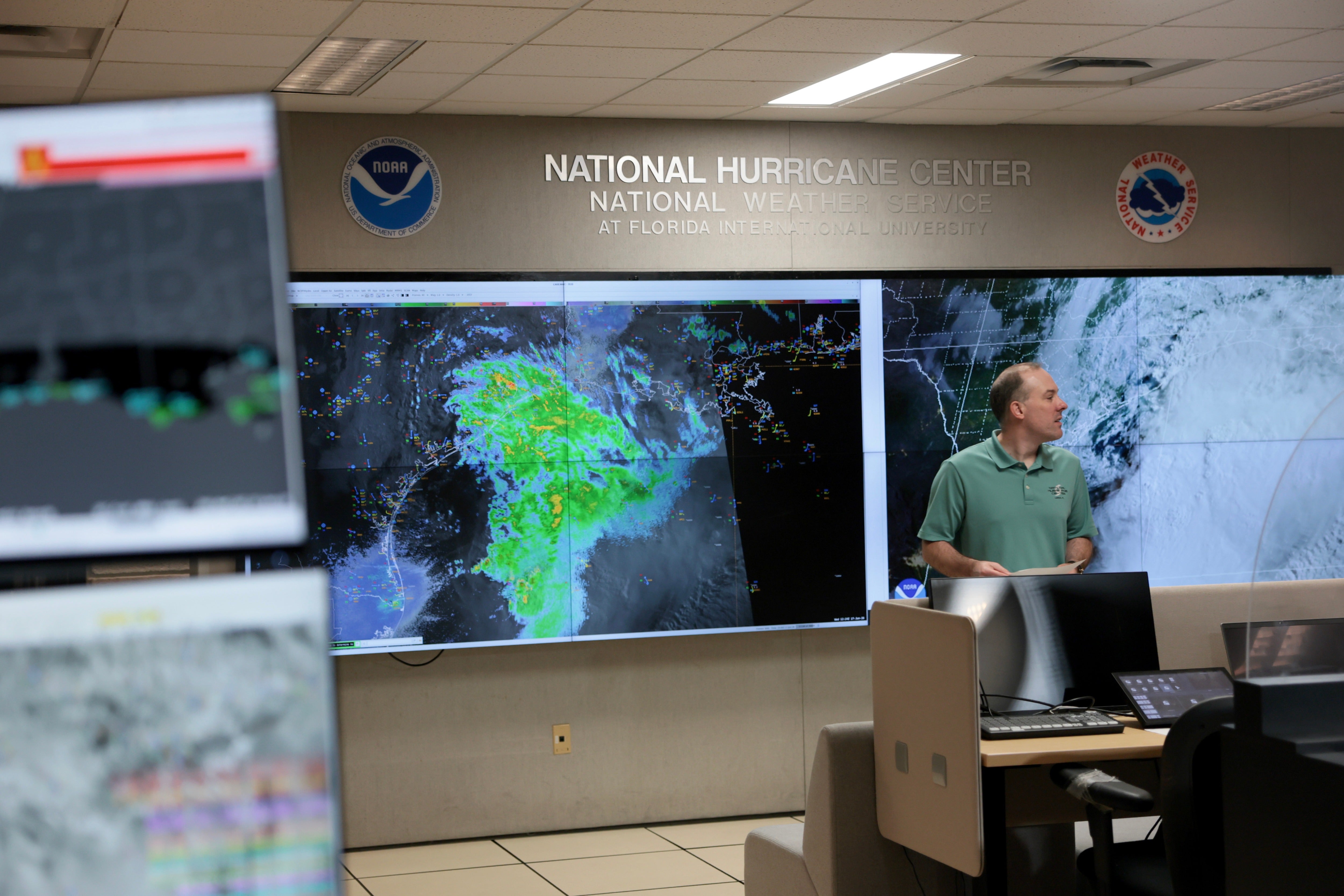 Brad Reinhart, Senior Hurricane Specialist, works on tracking Tropical Storm Arthur at the National Hurricane Center in June in Miami, Florida. NOAA says El Nino has been behind below-normal Atlantic hurricane activity